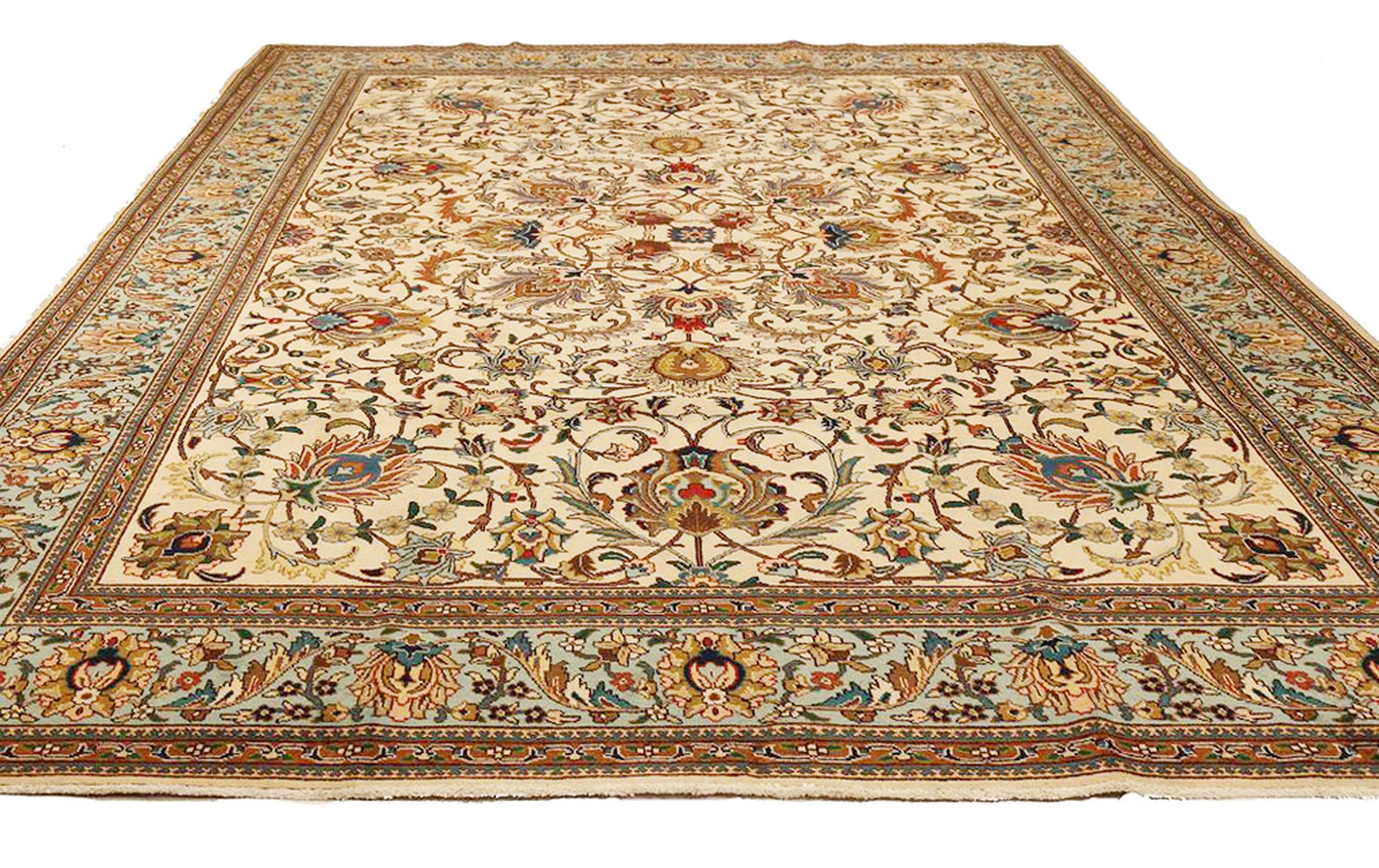 Antique Persian rug handwoven from the finest sheep’s wool and colored with all-natural vegetable dyes that are safe for humans and pets. It’s a traditional Tabriz weaving featuring a lovely ensemble of floral designs in various colors over an ivory