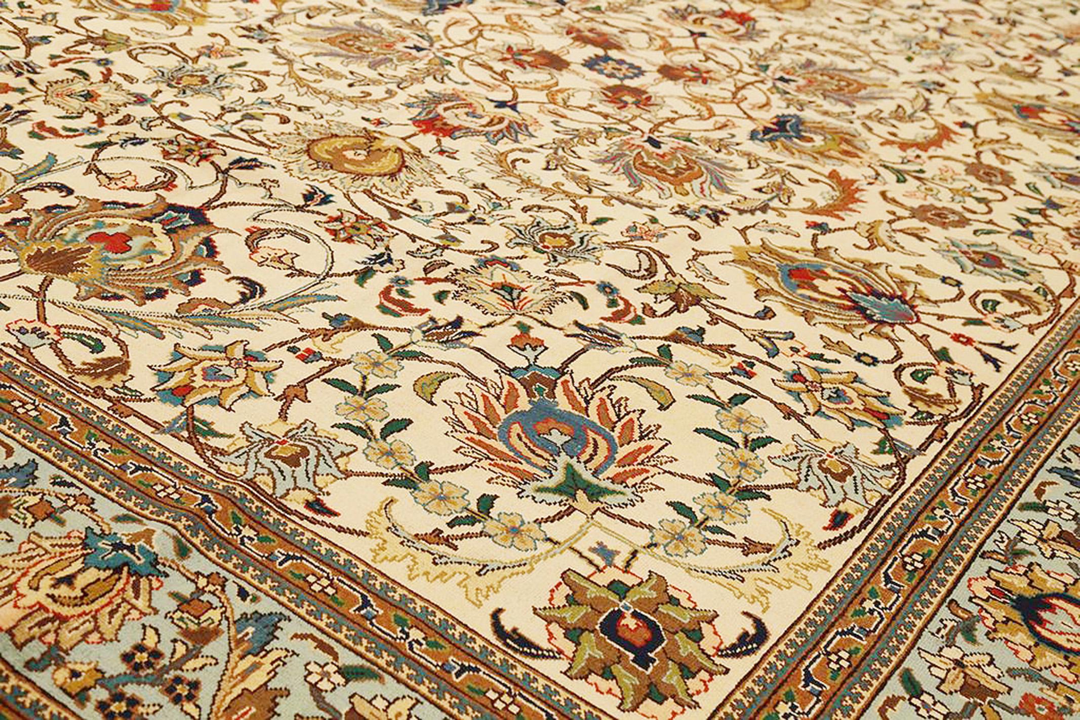 Hand-Woven Antique Persian Tabriz Rug with Colorful Flower Motifs on Ivory Field For Sale