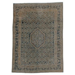 Antigua alfombra persa de Tabriz con elaborados motivos florales