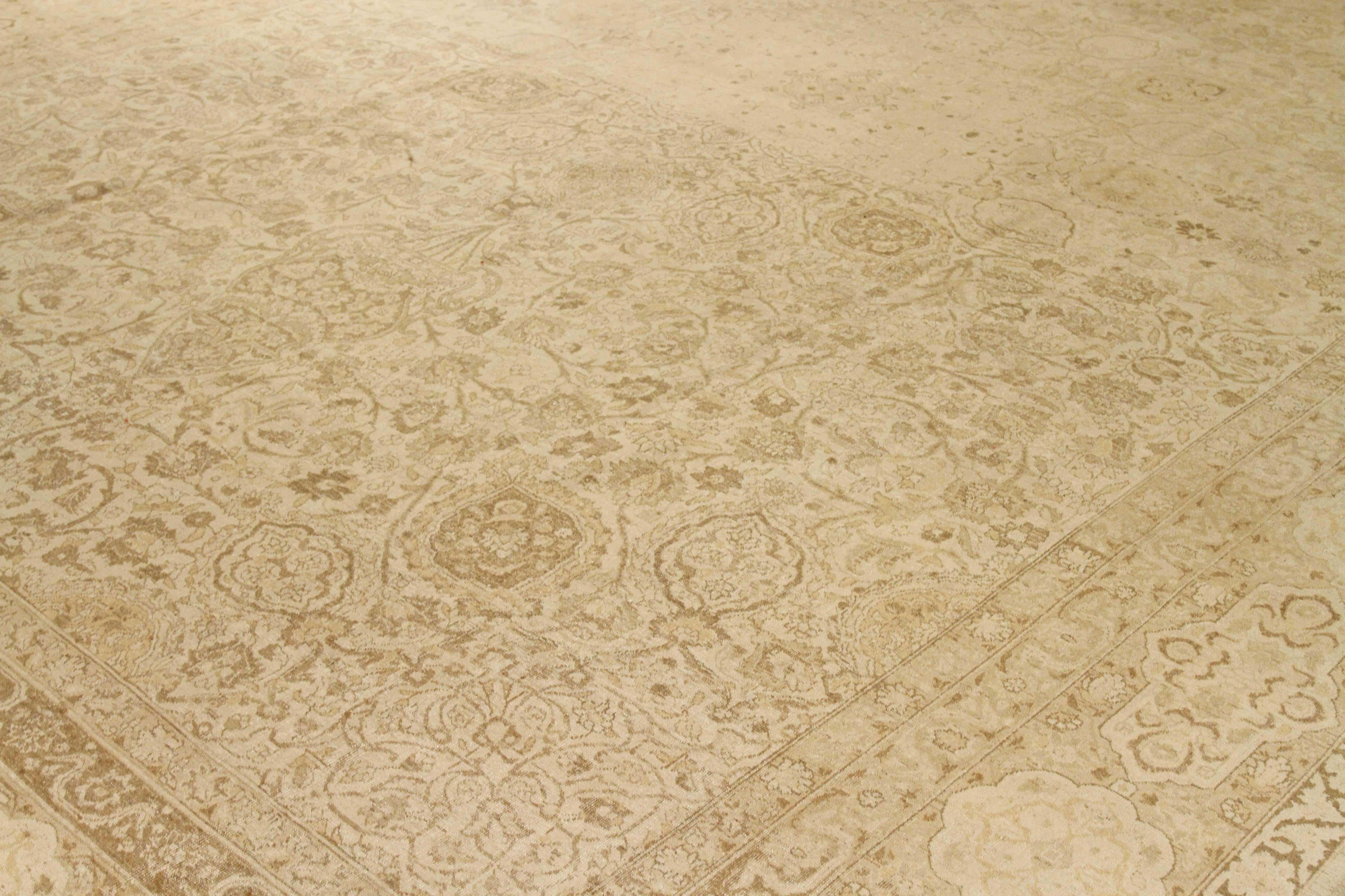 Hand-Woven Antique Persian Tabriz Rug with Faded Beige and Brown Floral Motifs For Sale