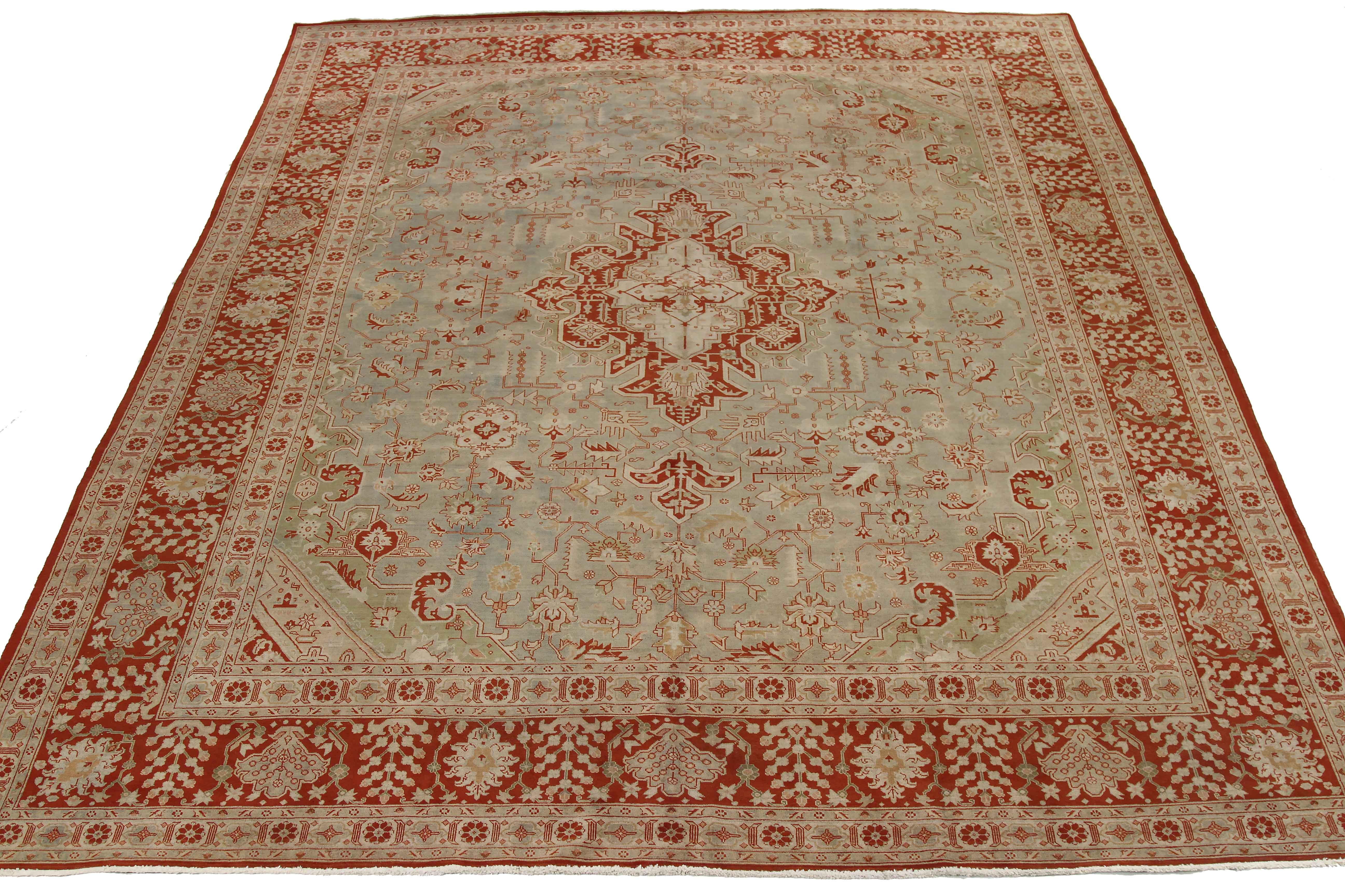 Antique Persian rug handwoven from the finest sheep’s wool and colored with all-natural vegetable dyes that are safe for humans and pets. It’s a traditional Tabriz weaving featuring a lovely ensemble of floral designs over a red and beige field.