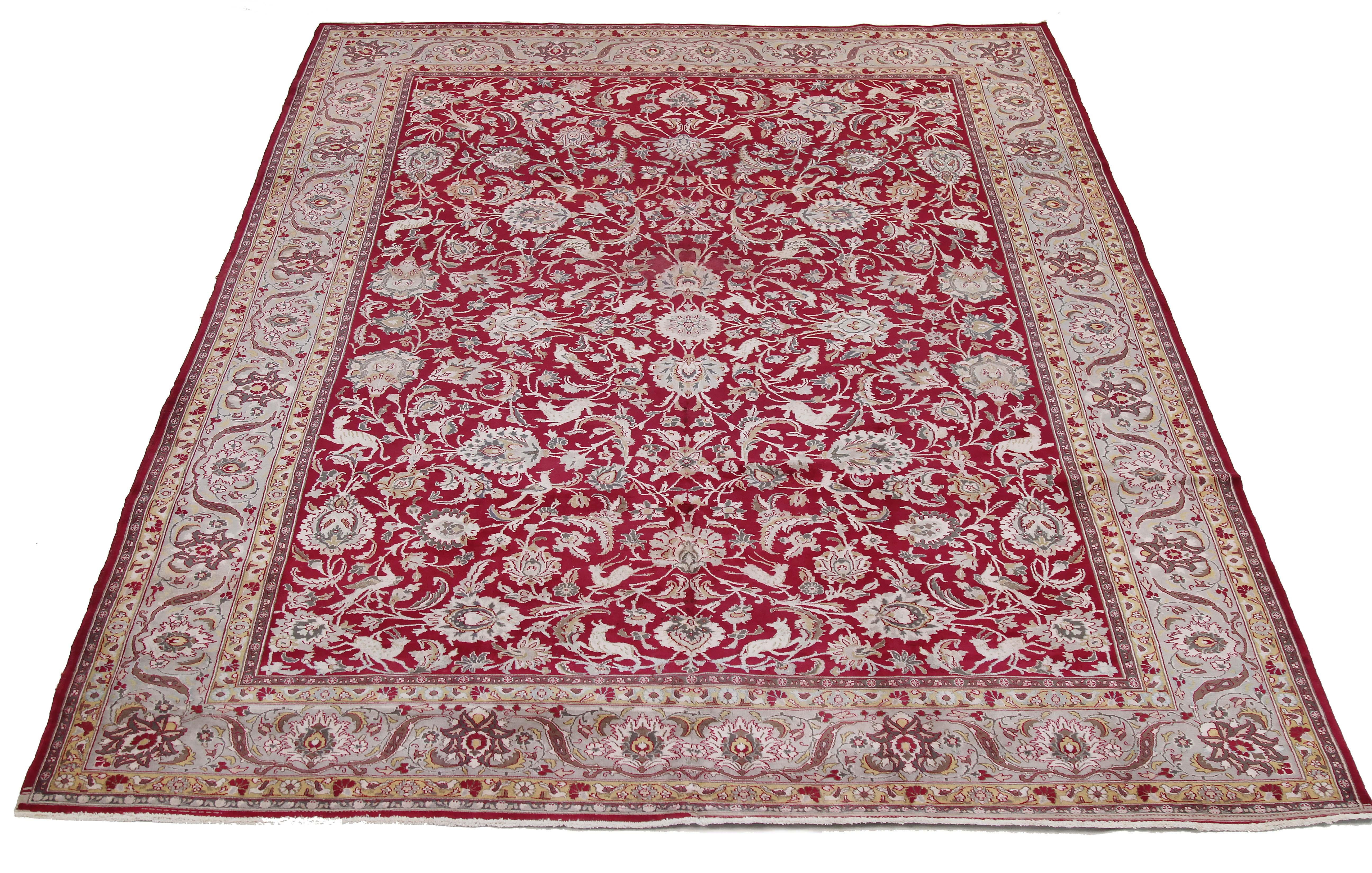 Antique Persian rug handwoven from the finest sheep’s wool and colored with all-natural vegetable dyes that are safe for humans and pets. It’s a traditional Tabriz weaving featuring a lovely ensemble of floral designs in beige and ivory over an
