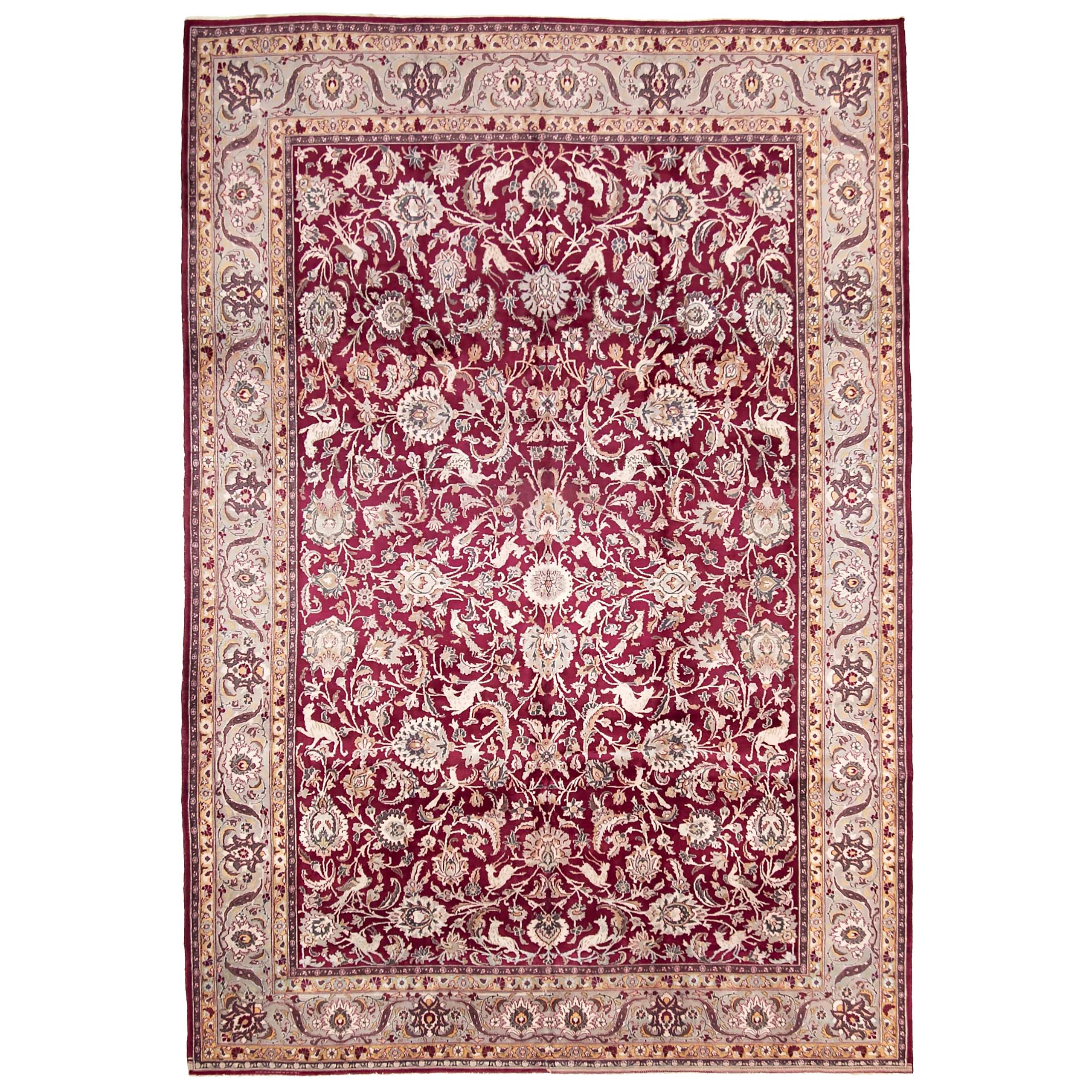 Antique Persian Tabriz Rug with Floral Details on Red Field For Sale