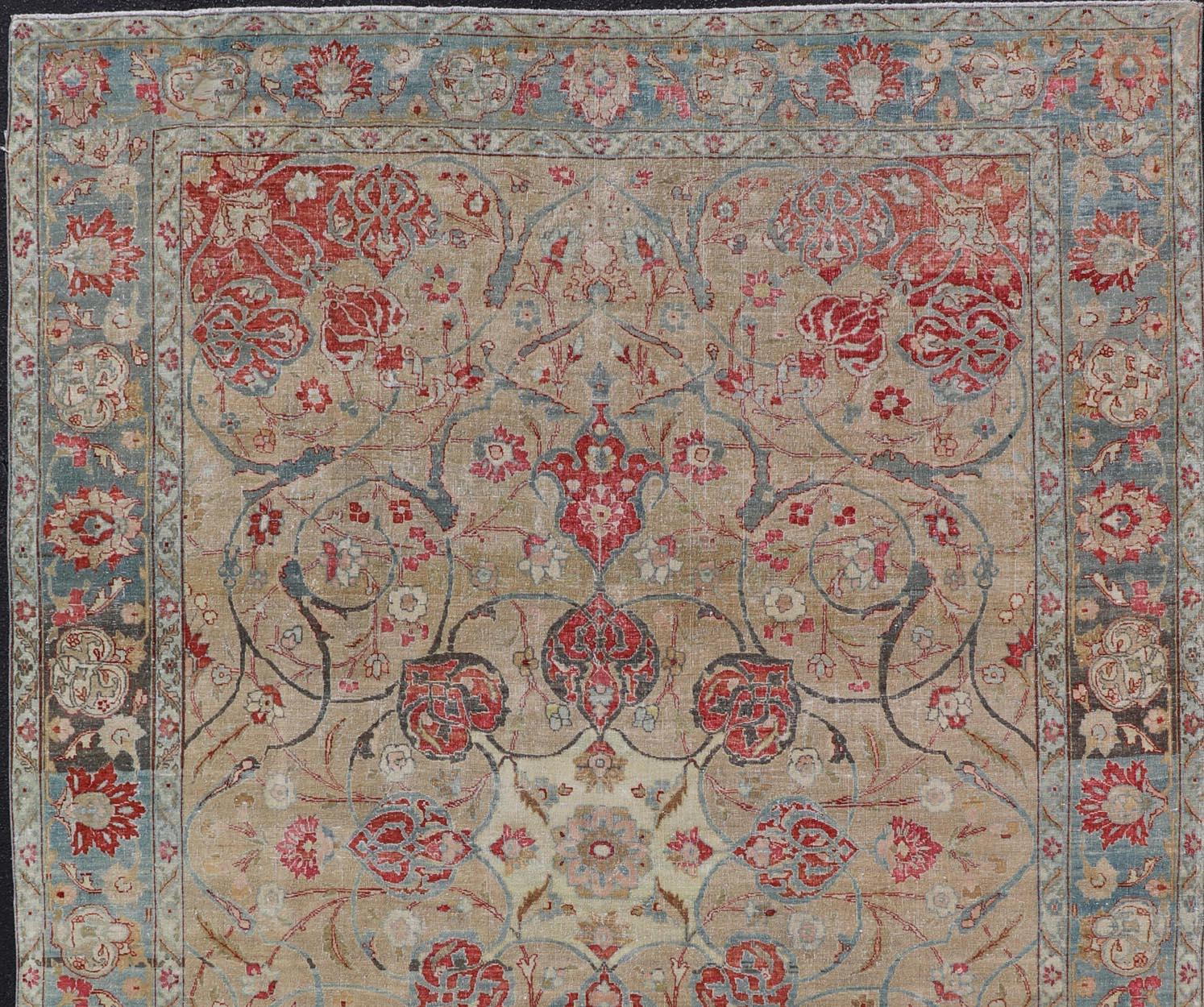 Wool Antique Persian Tabriz Rug with Floral Medallion Design in Tan, Red, and Blue For Sale