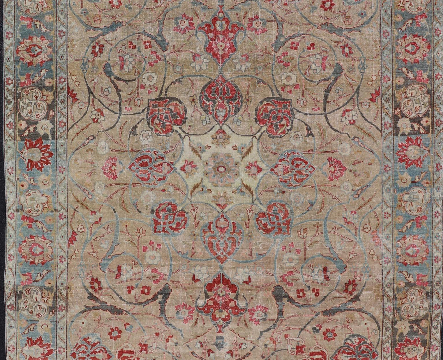 Antique Persian Tabriz Rug with Floral Medallion Design in Tan, Red, and Blue For Sale 1