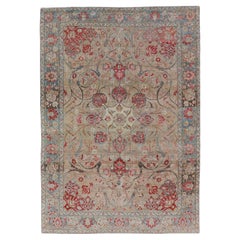 Antique Persian Tabriz Rug with Floral Medallion Design in Tan, Red, and Blue