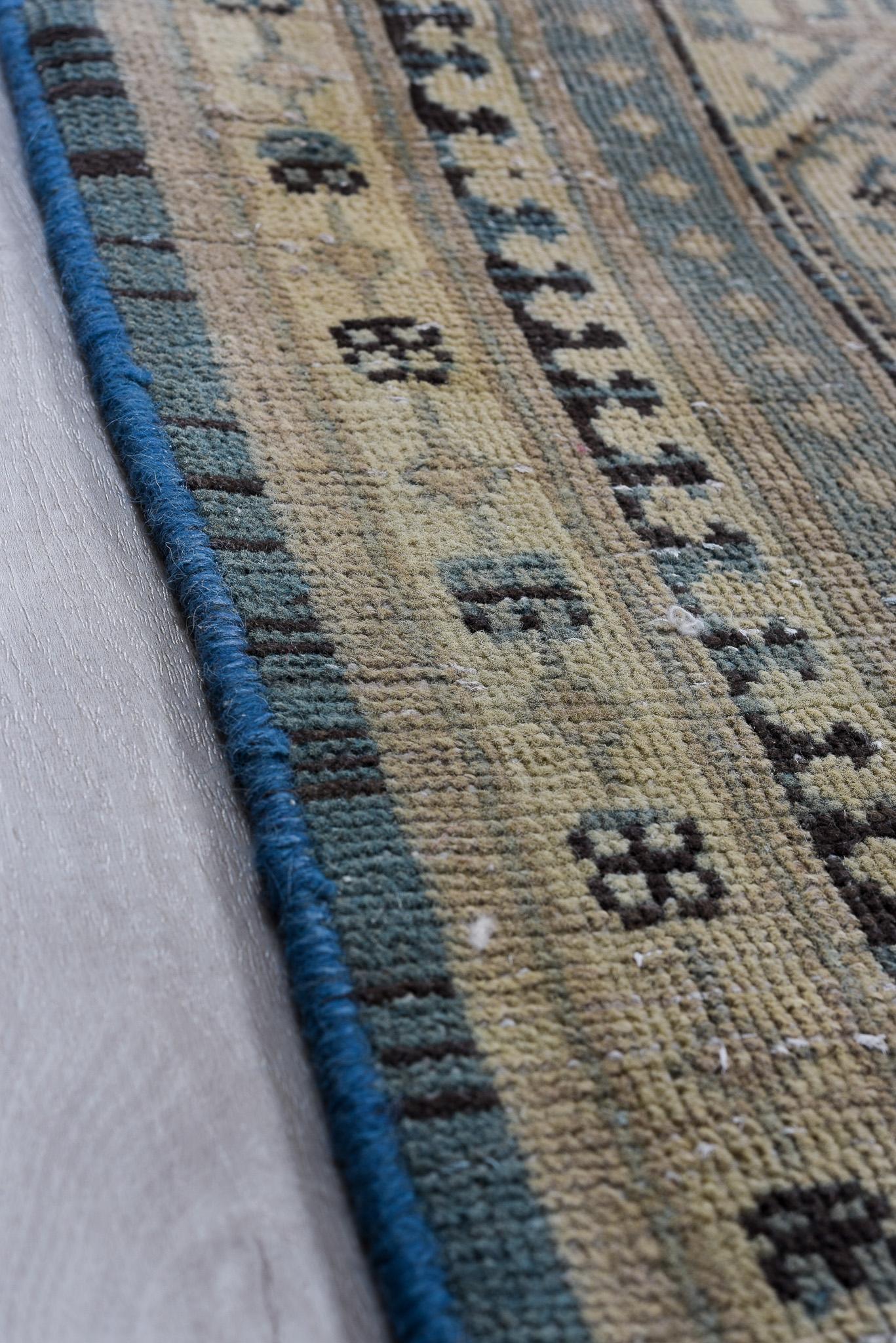 Featuring a grand floral medallion in soft blue and beige, this Antique Persian Tabriz Rug is a magnificent piece. The balanced color scheme and intricate detailing make it a perfect focal point for a sophisticated setting.