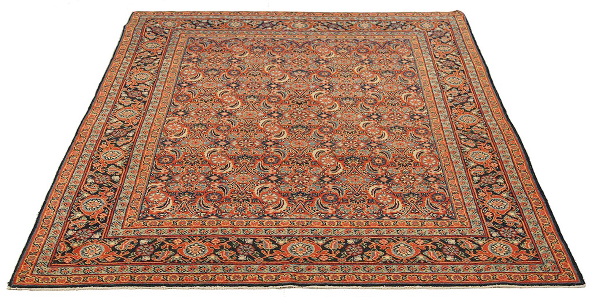 Antique Persian rug handwoven from the finest sheep’s wool and colored with all-natural vegetable dyes that are safe for humans and pets. It’s a traditional Tabriz weaving featuring a lovely ensemble of floral designs in gray and black over a beige