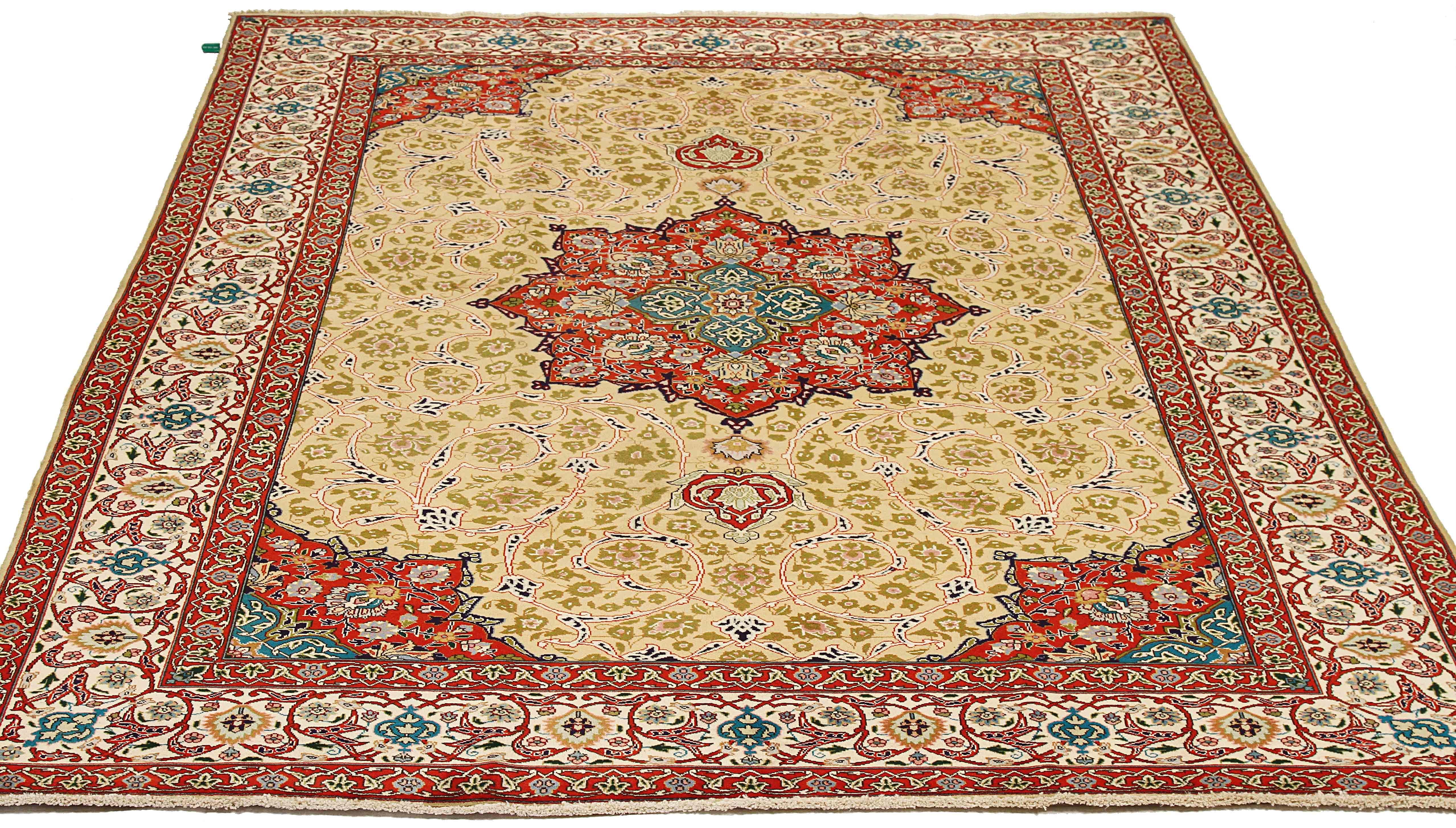Antique Persian rug handwoven from the finest sheep’s wool and colored with all-natural vegetable dyes that are safe for humans and pets. It’s a traditional Tabriz weaving featuring a lovely ensemble of floral details in green and pink on its center