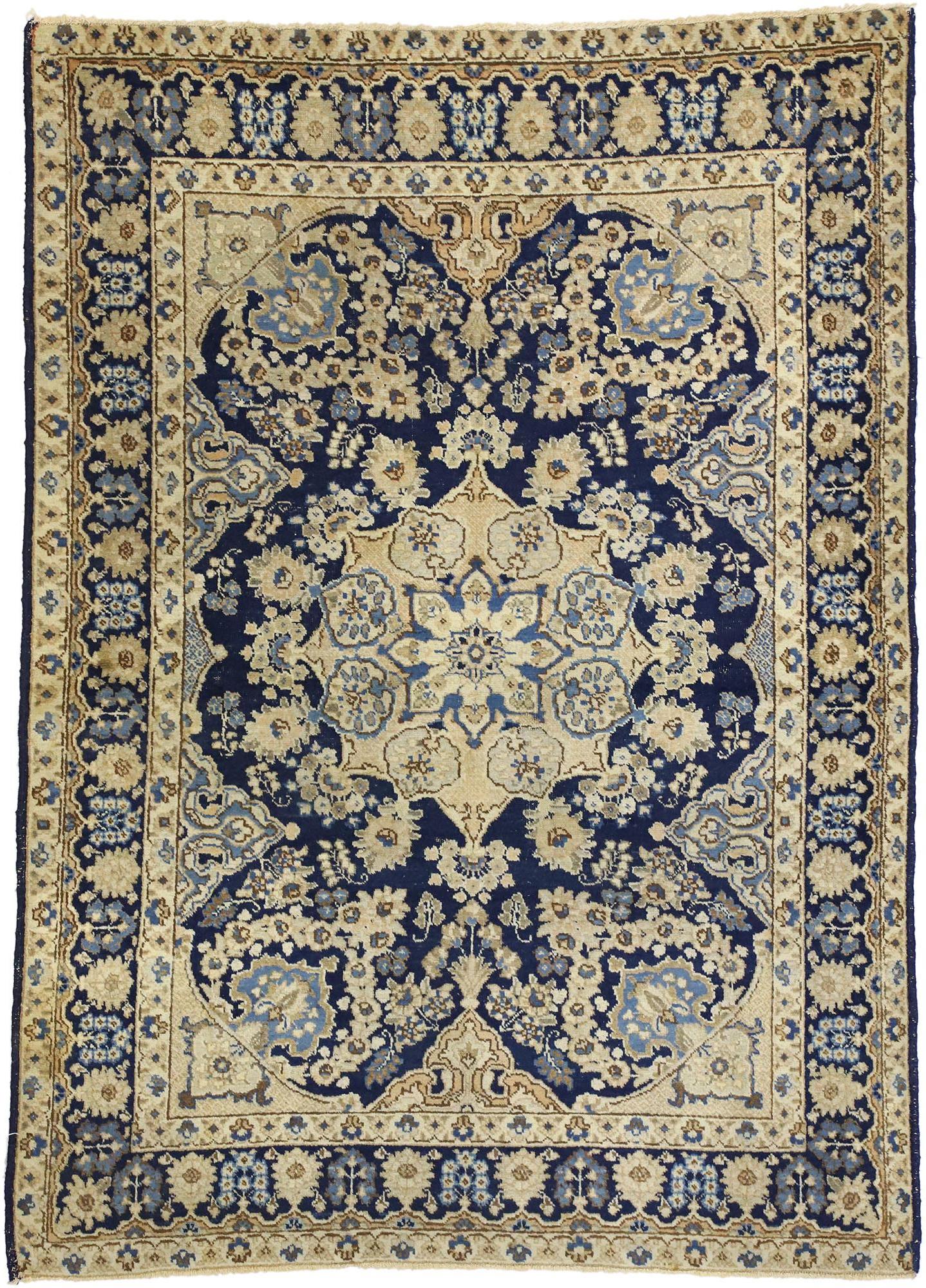 72737 Antique Persian Tabriz Rug with Hollywood Regency Style 04'06 x 06'02. This early 20th century antique Persian Tabriz rug with Hollywood Regency style with a twist of neoclassical glamour. Features a large center medallion in a navy blue field