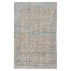 Antique Persian Tabriz Rug with Intricate Floral Design