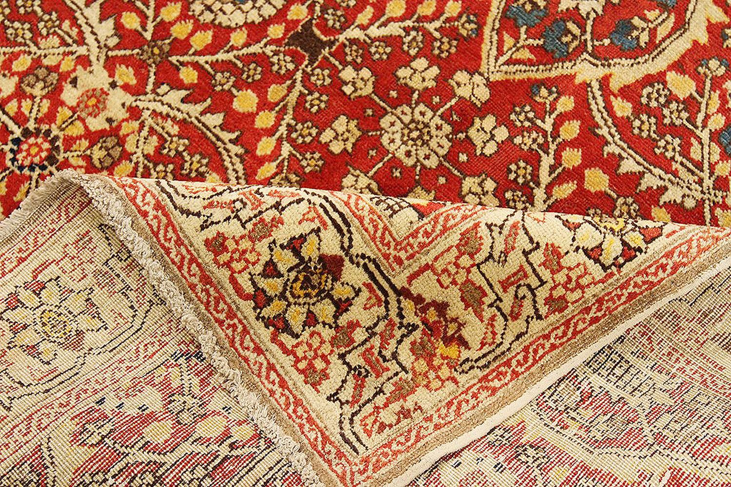 Hand-Woven Antique Persian Tabriz Rug with Ivory and Navy Flower Details on Red Field For Sale