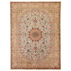 Antique Persian Tabriz Rug with Red and Blue Flower Motifs on Ivory Field