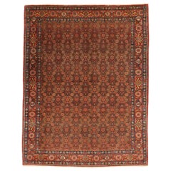 Tapis persan ancien de Tabriz avec motifs de fleurs rouges et vertes sur toute la surface