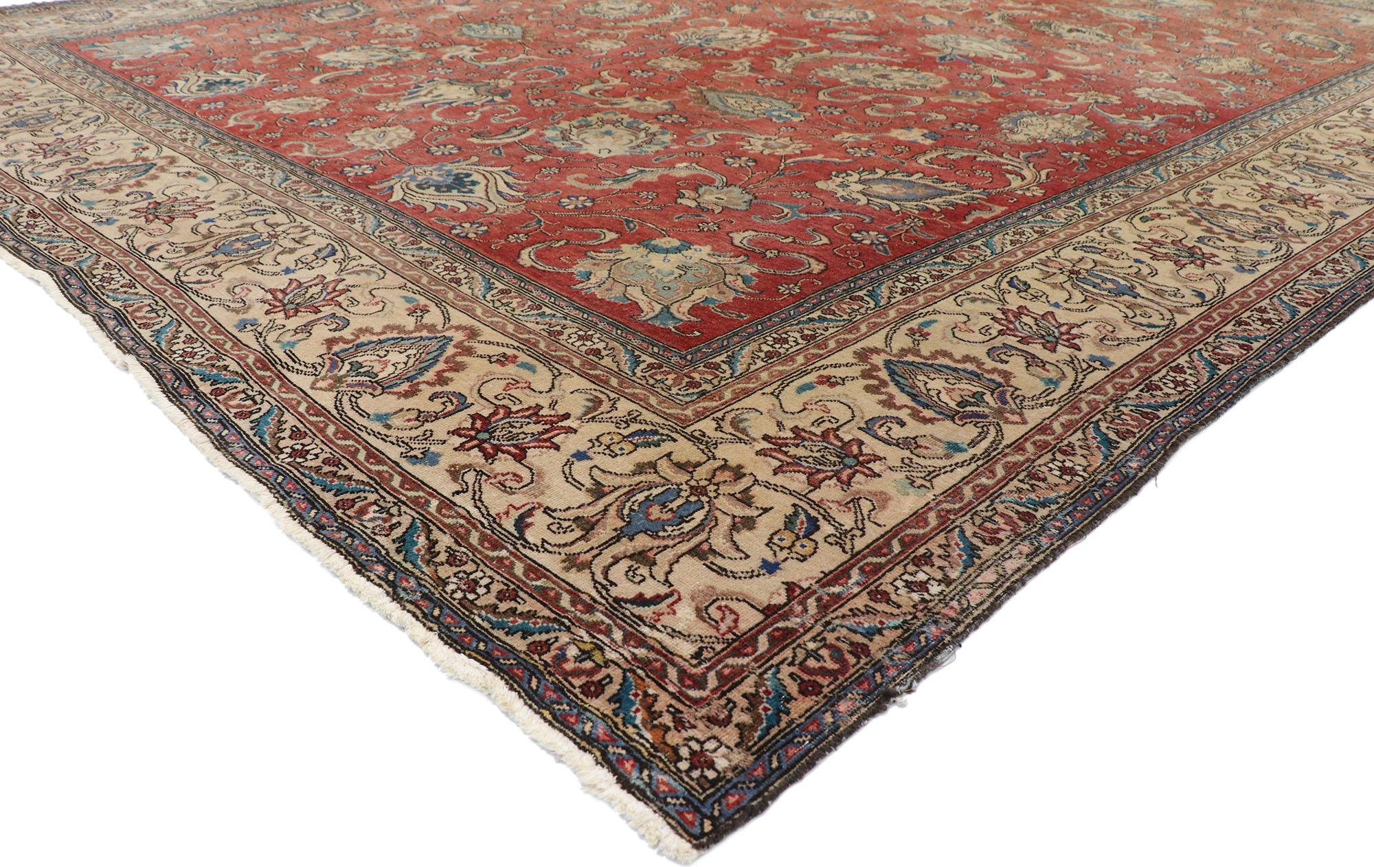 77642 Antique Persian Tabriz rug with Rustic Federal style. With ornate details and rustic sensibility, this hand knotted wool antique Persian Tabriz rug is poised to impress. The abrashed field is covered in an all-over botanical pattern composed