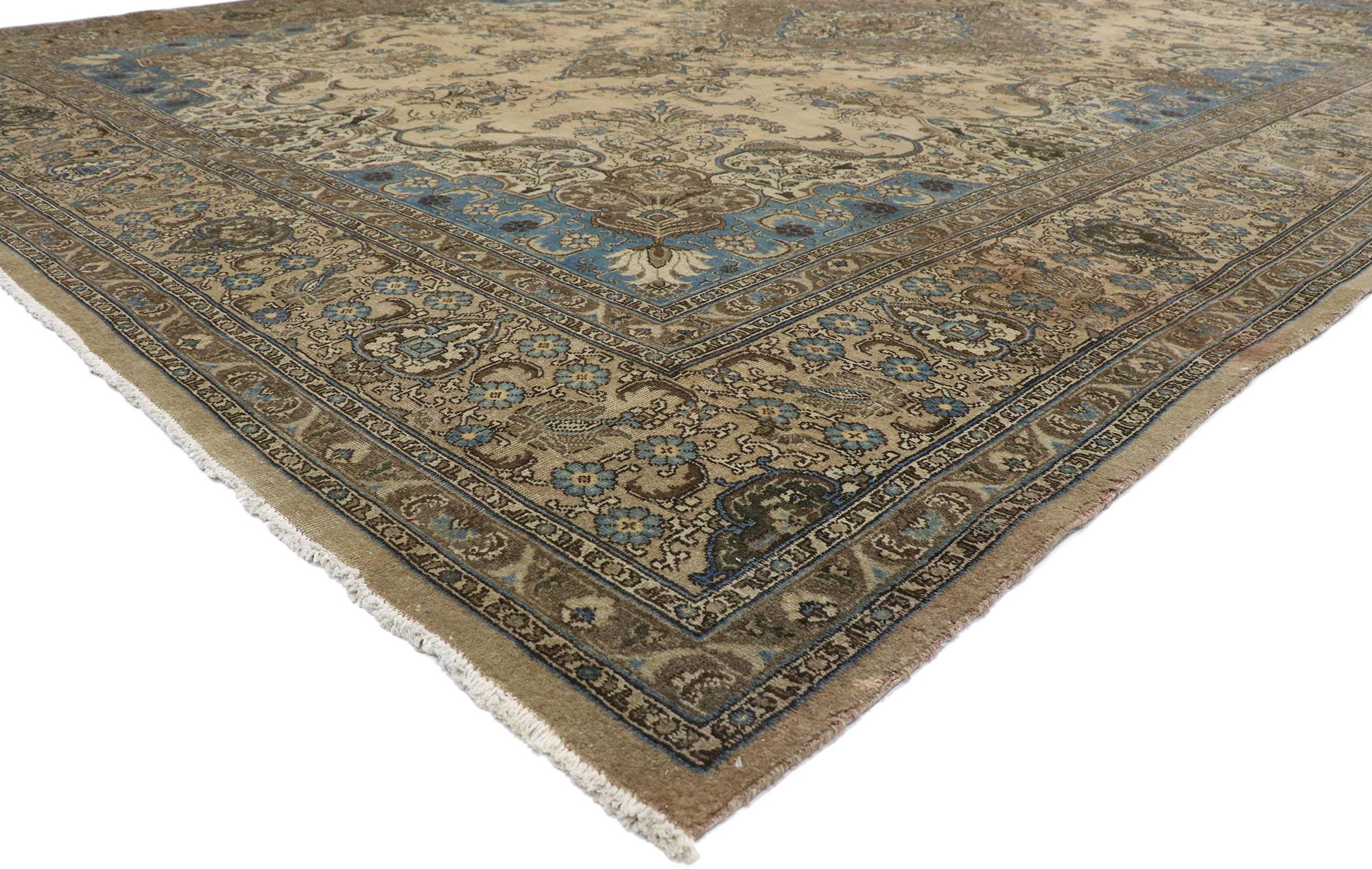 78090 Antique Persian Tabriz rug with Rustic French Cottage Style 12'04 x 18'05. Understated elegance combined with cool blue hues and warm taupe tones, this hand-knotted wool antique Persian Tabriz rug is poised to impress. Taking center stage is a