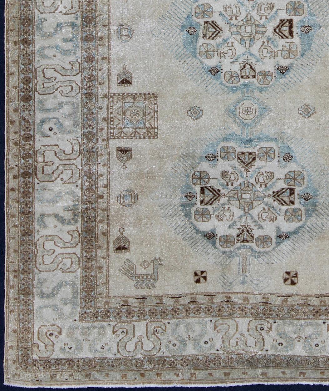 Keivan Woven Arts- Earth Tones and light blue antique Persian Ardebil Tabriz rug with medallions, rug E-1106, country of origin / type: Iran / Tabriz, circa 1930
Antique Persian Tabriz Rug With Three Medallions in Muted Earth Tones, ivory, brown and