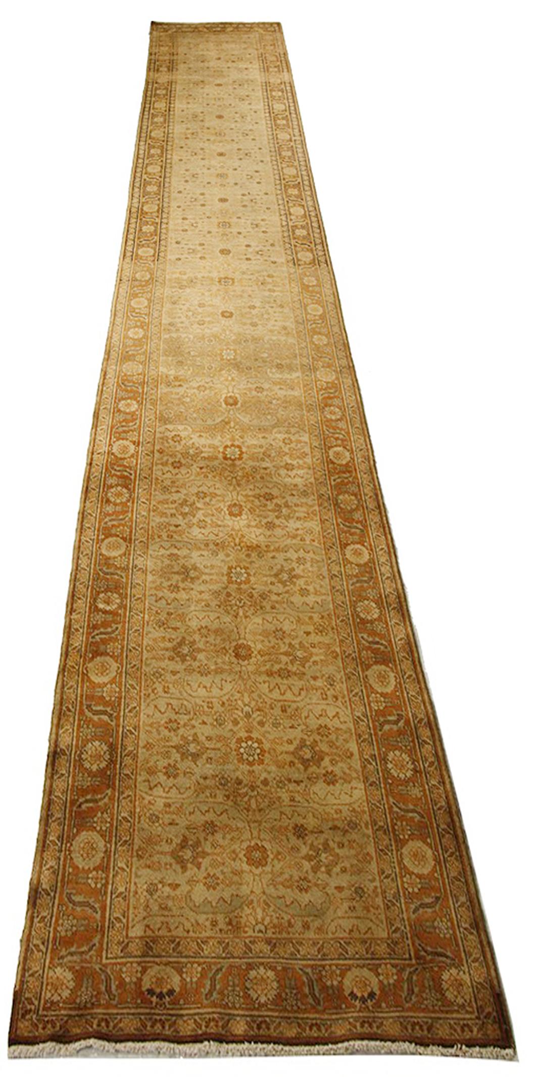Antique Persian runner rug 11372 handwoven from the finest sheep’s wool and colored with all-natural vegetable dyes that are safe for humans and pets. It’s a traditional Tabriz weaving featuring a lovely ensemble of floral designs in brown and white