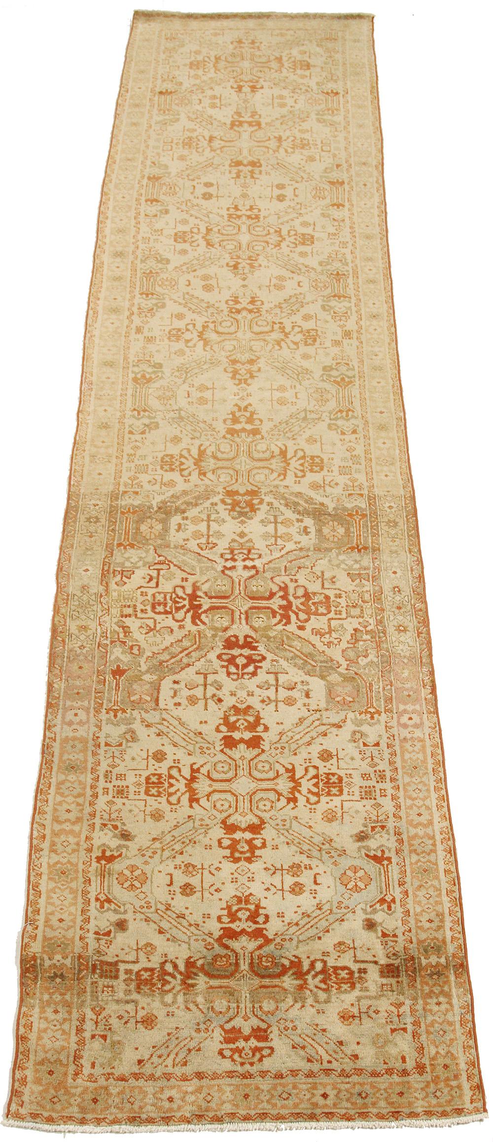 Antique Persian rug handwoven from the finest sheep’s wool and colored with all-natural vegetable dyes that are safe for humans and pets. It’s a traditional Tabriz weaving featuring a lovely ensemble of botanical designs in red and orange over an