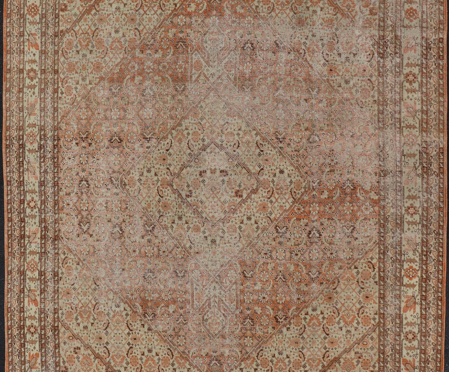 Hand-Knotted Antique Persian Tabriz with All-Over Medallion Design in Orange and Browns For Sale