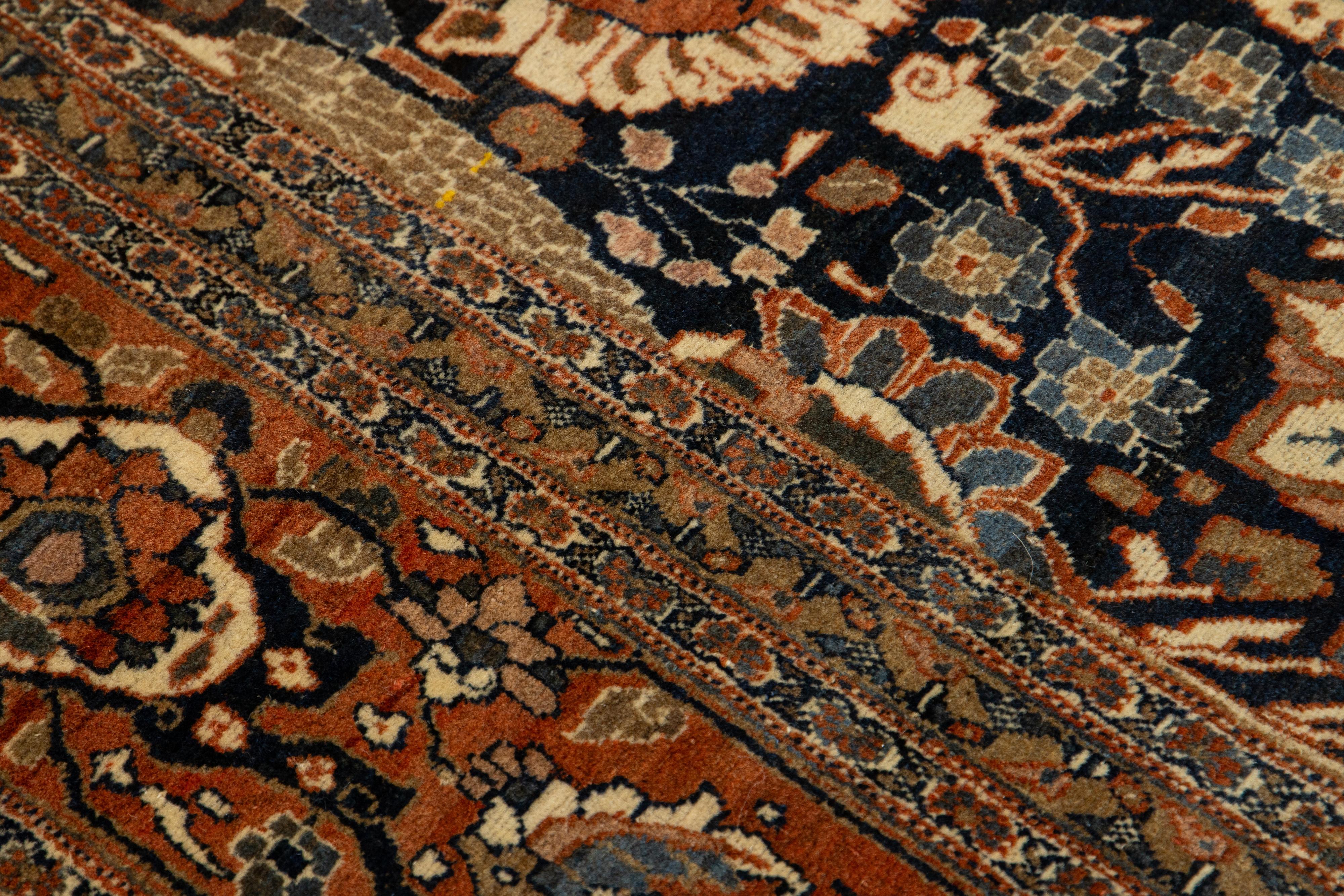 Noué à la main Tapis persan ancien en laine Tabriz avec un design floral classique en bleu et rouille en vente
