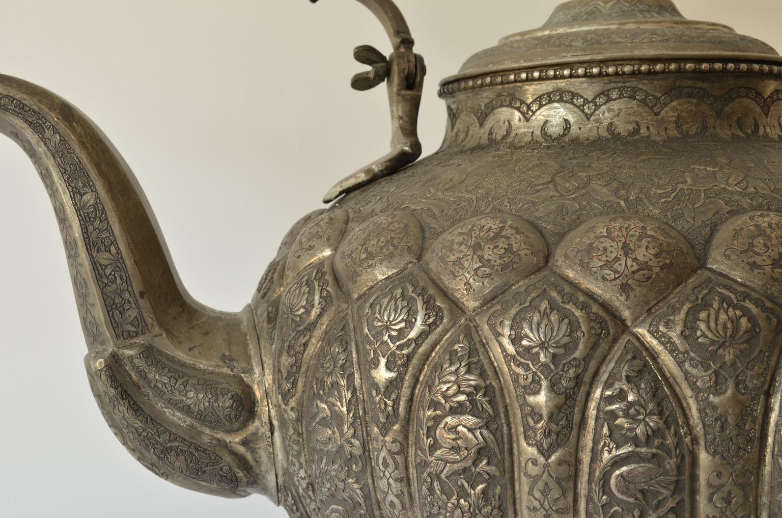 Large teapot, waterpot with neat engraved Polo game scenes and hunting scenes.
Tinned copper, Persia, Isfahan, 19th century, hallmarked and monogrammed on the bottom.
Weight: 3360 Gramm.
Measures: Height 36 cm with lid, height 45 cm with