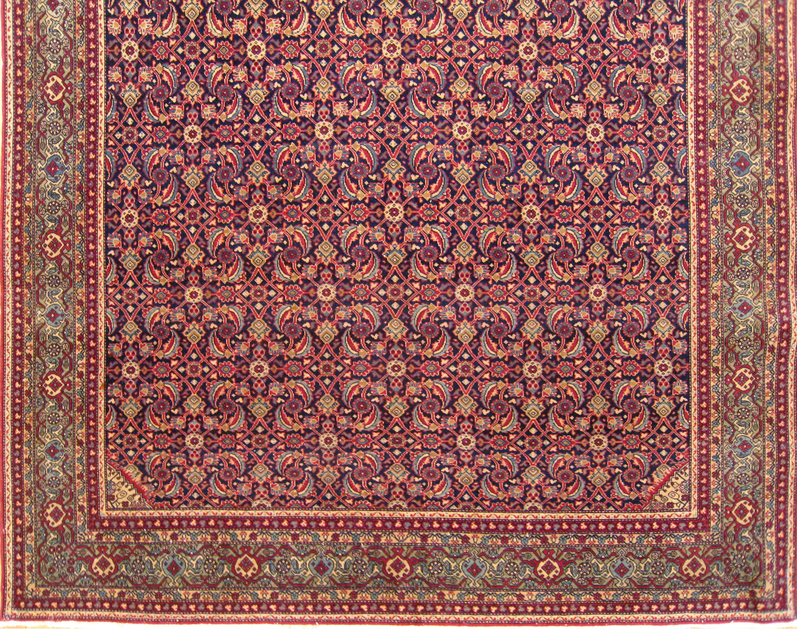 Hand-Knotted Antique Persian Tehran Small Carpet with Repeating Herati Design on a Navy Field For Sale