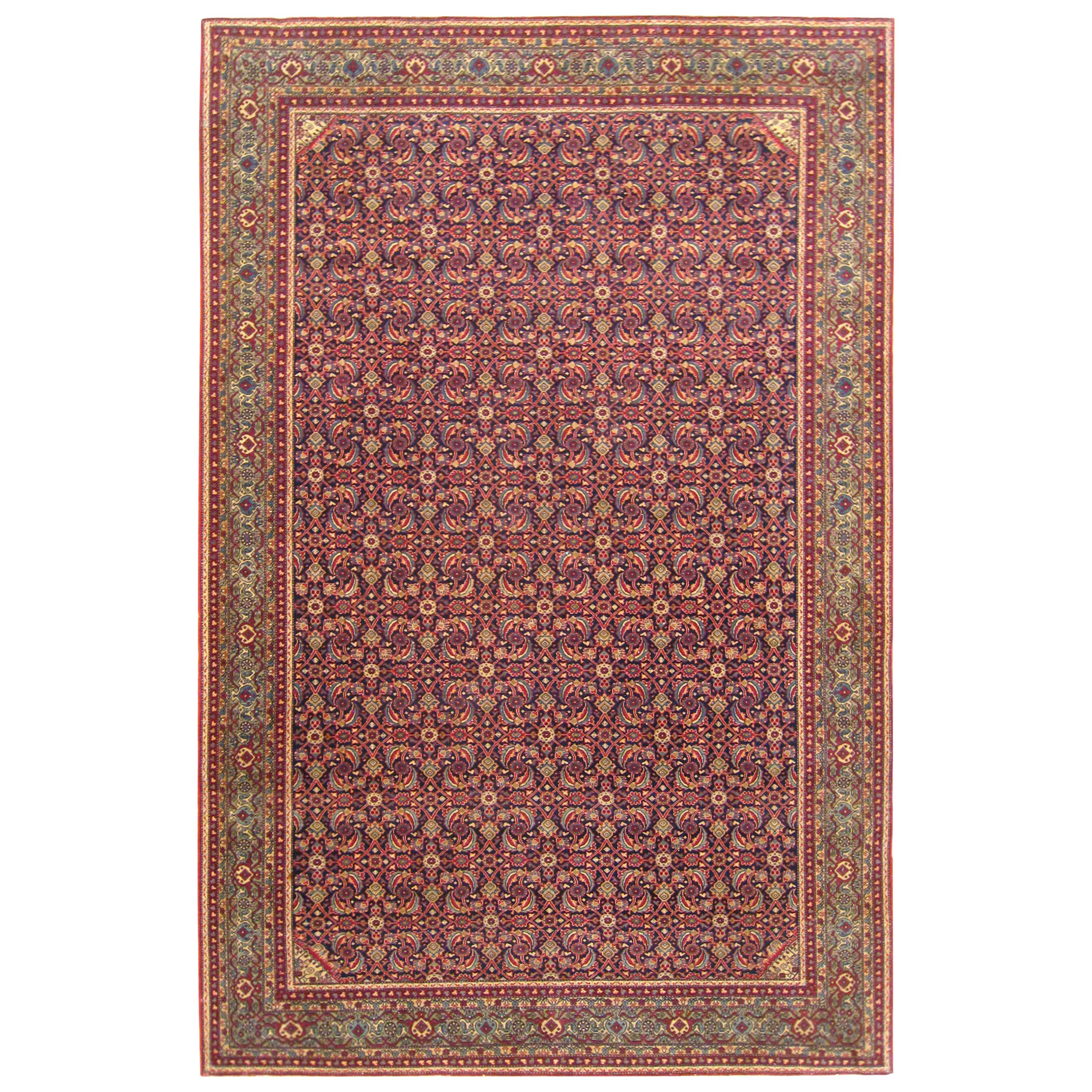 Antique Persian Tehran Small Carpet with Repeating Herati Design on a Navy Field For Sale