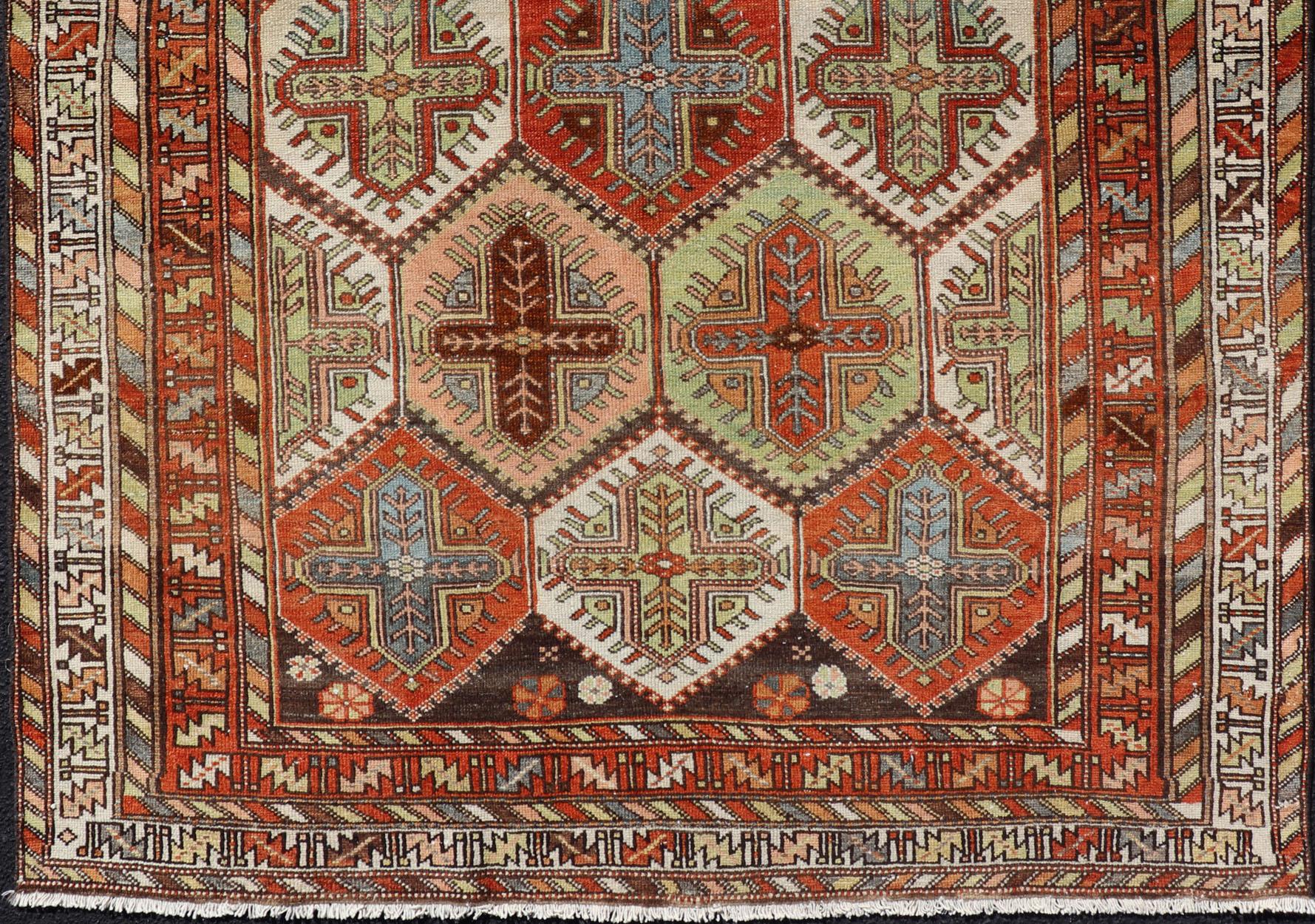 Antique Persian Tribal Garden design with crosses Bakhtiari rug in multi colors. 
Keivan Woven Arts / rug EMB-9550-P13055, country of origin / type: Iran / Bakhtiari, circa 1920.
This magnificent Antique Bakhtiari Rug features an all-over diamond