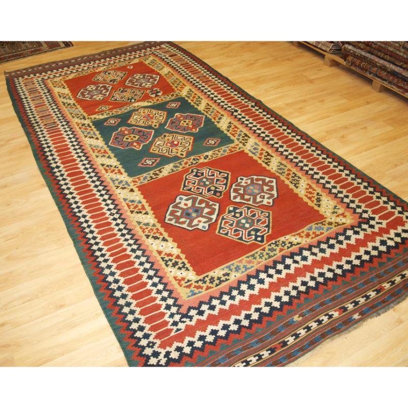 Antique Persian tribal Qashqai kilim, South West Persia.

A good Qashqai kilim with a bold three compartment design, natural dye colours throughout. Each of the three compartments contains four small medallions. The borders are a particular feature