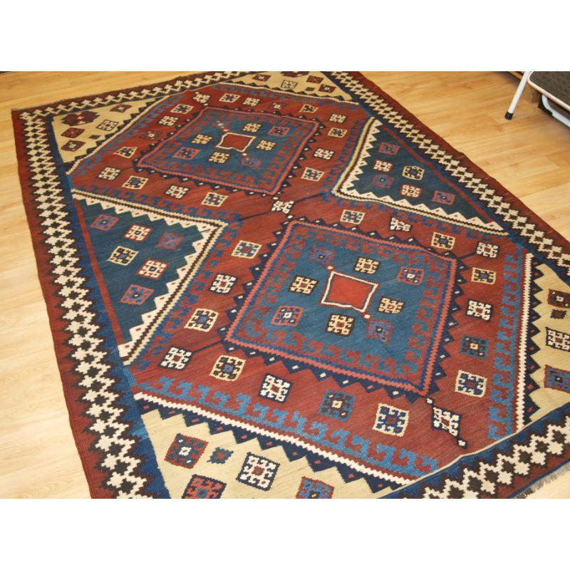 Antique Persian tribal Qashqai kilim, South West Persia.

A good Qashqai kilim with very bold diamond medallion design, natural dye colours throughout.

Excellent condition, very slight wear.

Hand washed and ready for use or display.

Additional