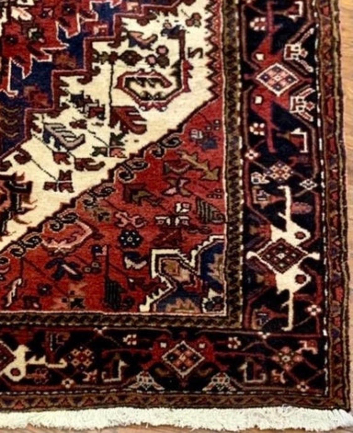 Hand-Knotted Antique Persian Tribal Red Navy Blue Heriz Area Rug, circa 1960s For Sale
