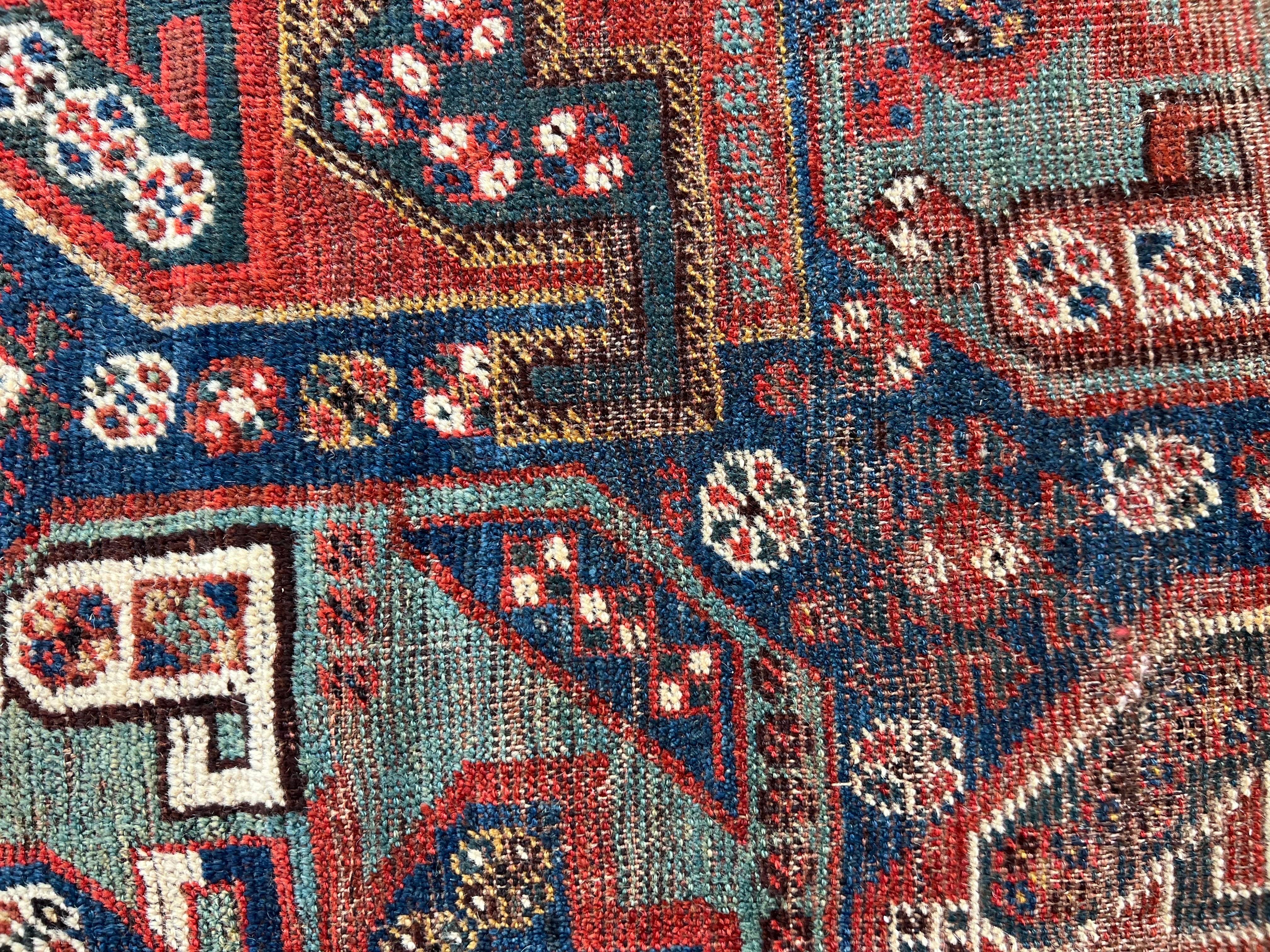 Tribal rugs made in Shiraz and surrounding areas were usually no larger than 6 x 9, so this nearly 8 x 10 size is quite rare! The rug does have areas of wear down to the foundation - see photos. The foundation of this tribal rug is a gray/brown