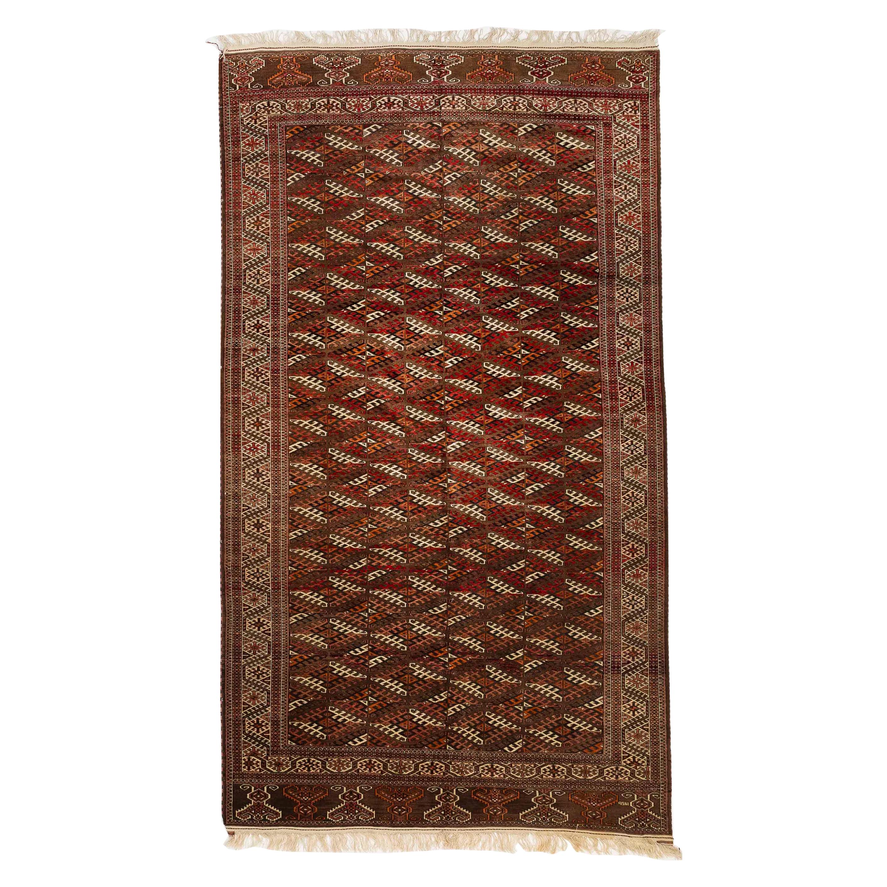 Antique Persian Turkmen Rug with Black and White Diamond Patterns on Red Field For Sale