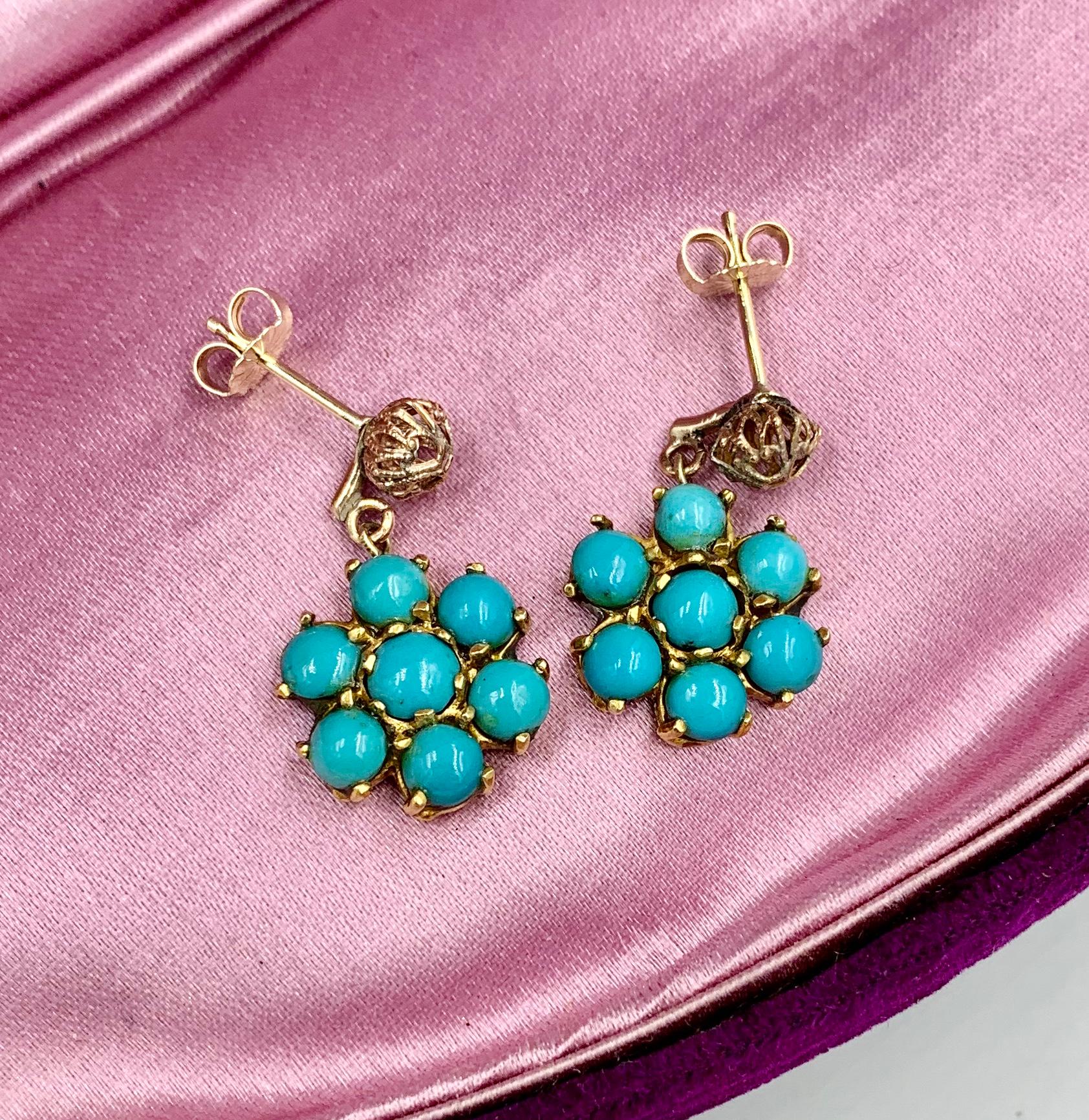 A gorgeous pair of Art Deco Style - Retro Persian Turquoise flower cluster motif dangle drop earrings in 14 Karat Yellow Gold.  The wonderful flower motif earrings are each set with 7 round Persian Turquoise cabochons of great beauty.   The