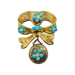 Antiguo broche de turquesa persa Broche de medallón No me olvides Motivo de lazo Victoriana