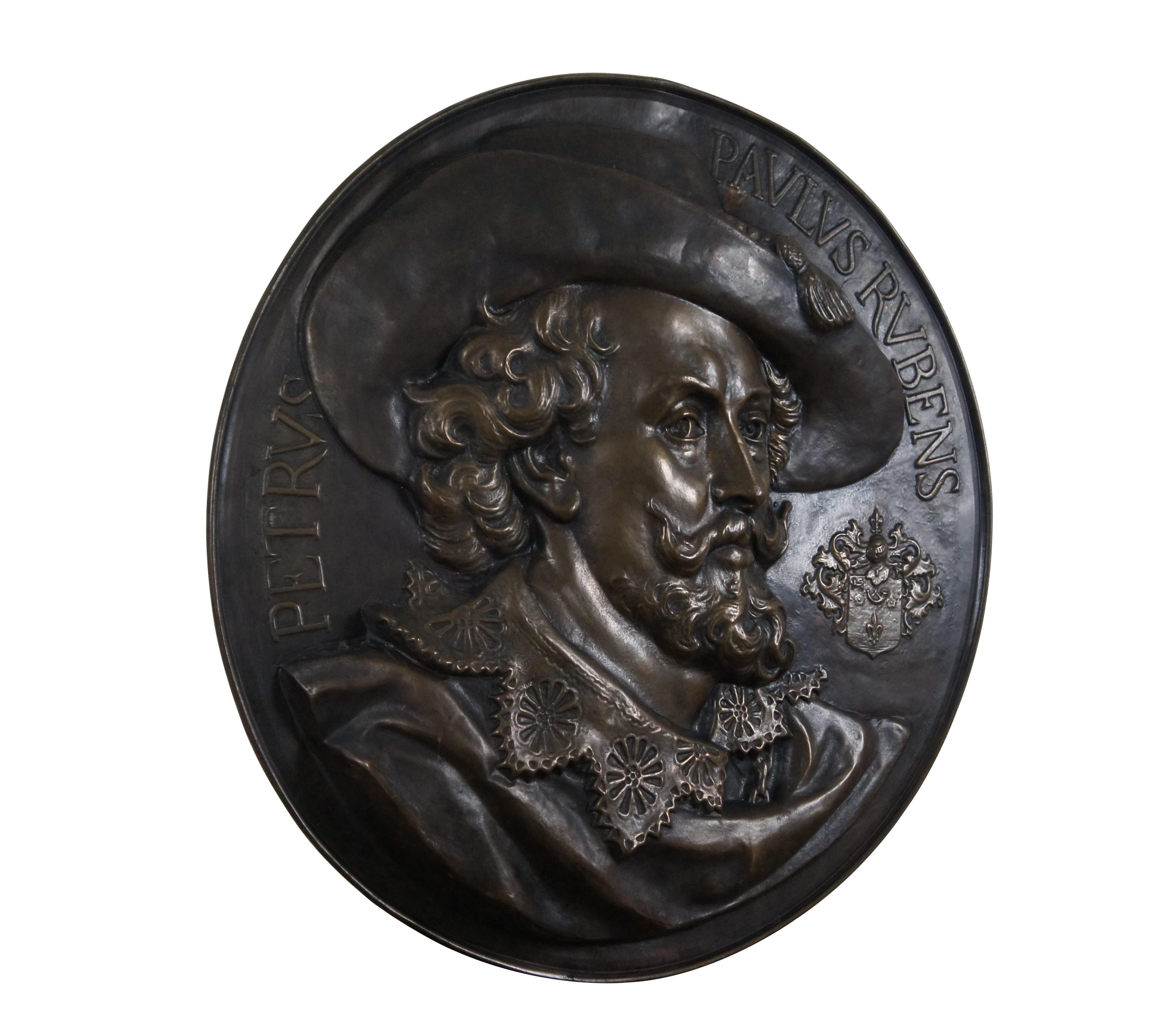 Early 20th century embossed copper wall hanging bust portrait plaque featuring a portrait of Flemish artist Peter Paul Rubens, framed by his name in Latin and accented with a coat of arms.

