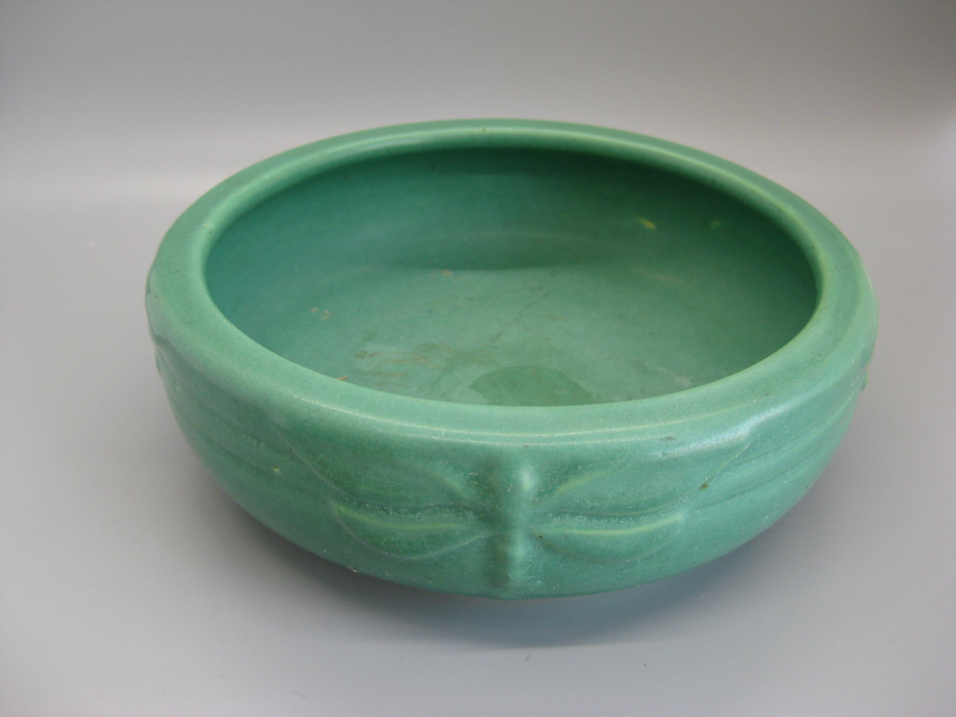 Wonderful Arts & Crafts green matte art pottery bowl made by Peters & Reed in Zanesville, Ohio. Dates from the early 1900s. Wonderful color and shape. Has dragonflies around the sides as decorations. Would look great in any Arts & Crafts decor. In