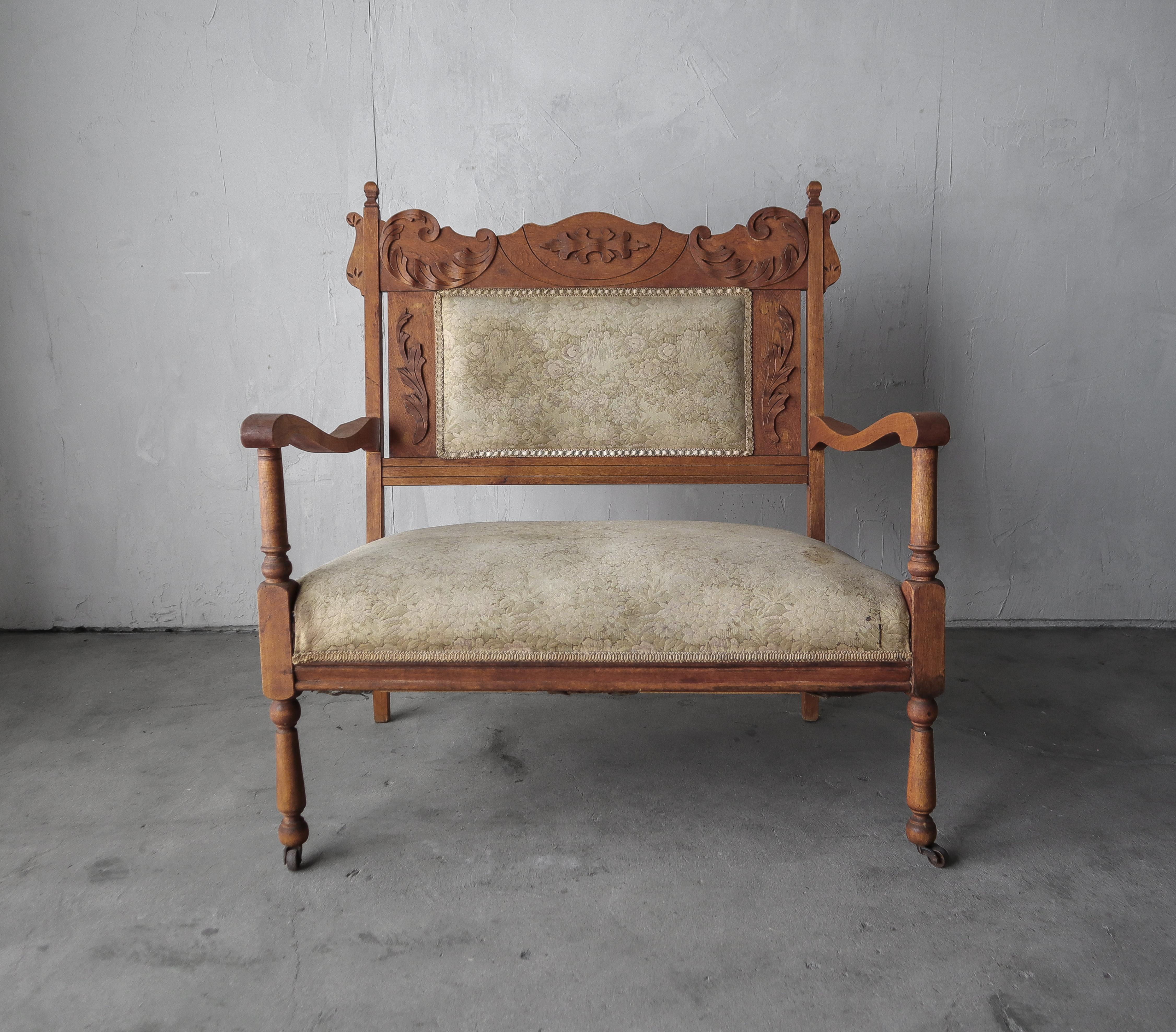 A beautiful antique sitting piece, with intricate carved wood details.  Can be used as a bench, settee or an oversized chair.  A beautiful antique decor piece.

Left as found, structurally the piece is sound, and we left the original fabric because