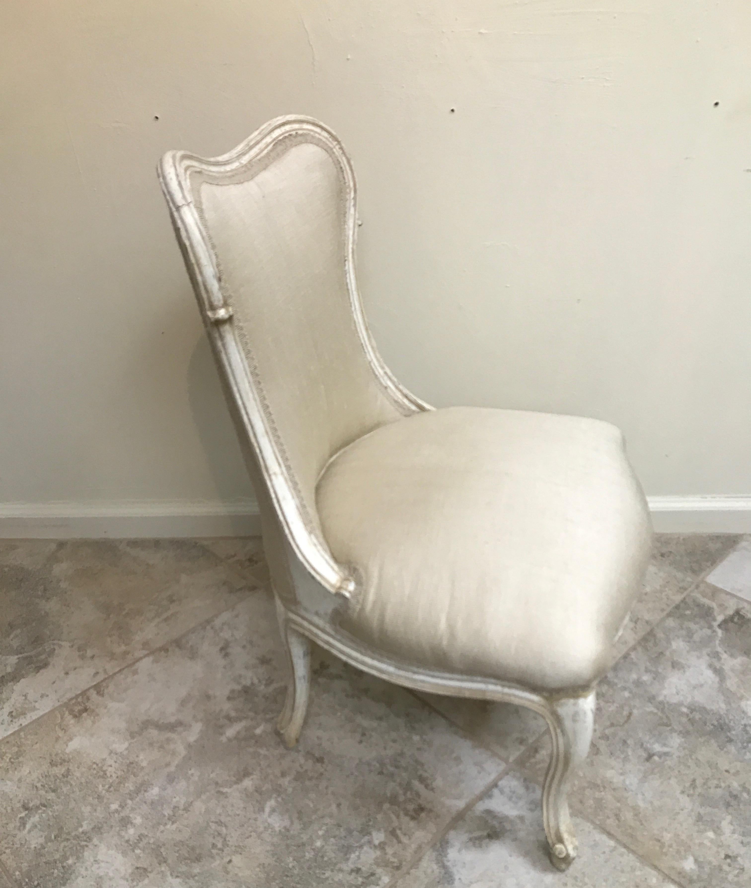 Sweet French slipper chair with original painted frame and newly upholstered raw silk fabric. Very Hollywood Regency.
