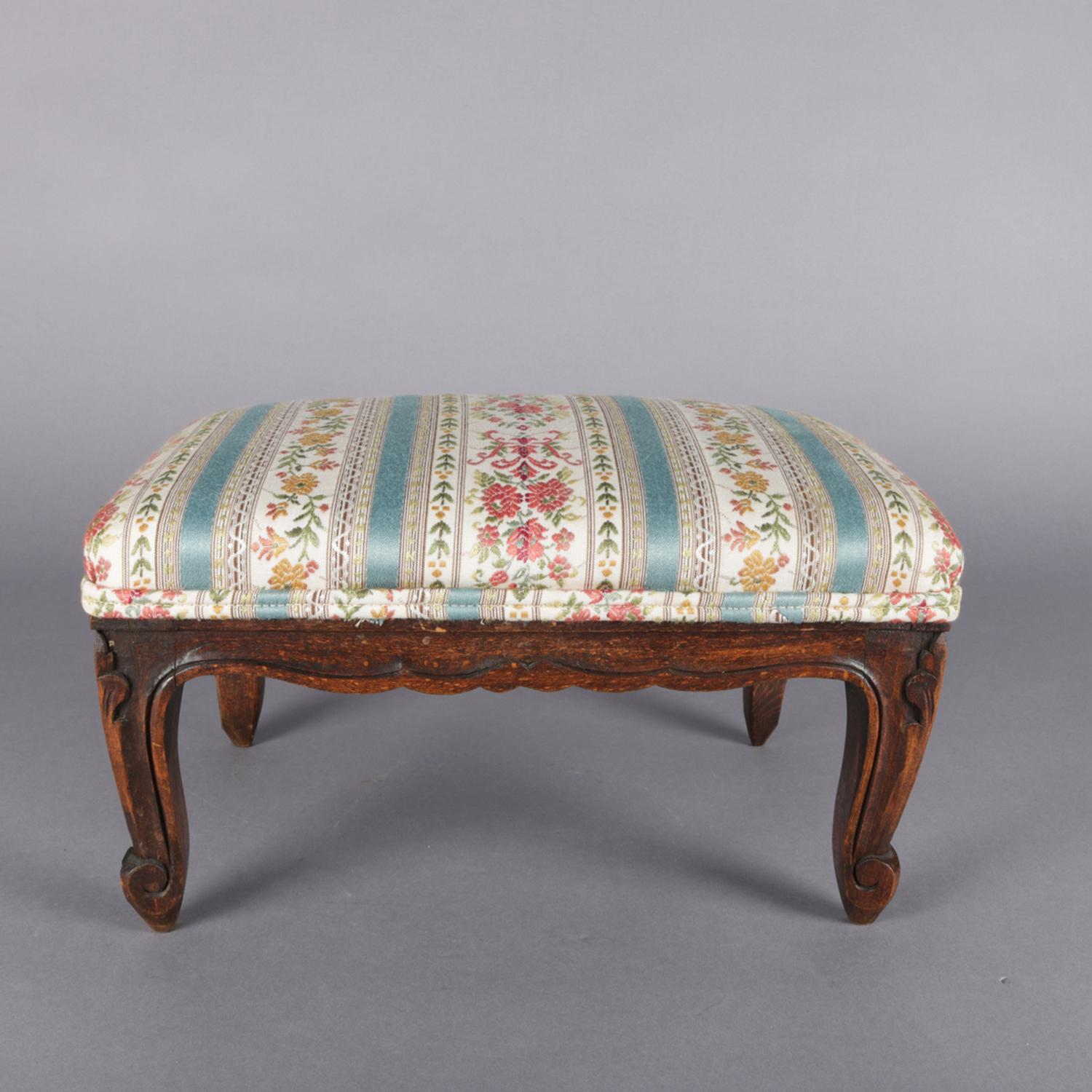 Petite French Louis XVI footstool features carved walnut frame with cabriole legs below upholstered seat, circa 1900

Measures: 7.5