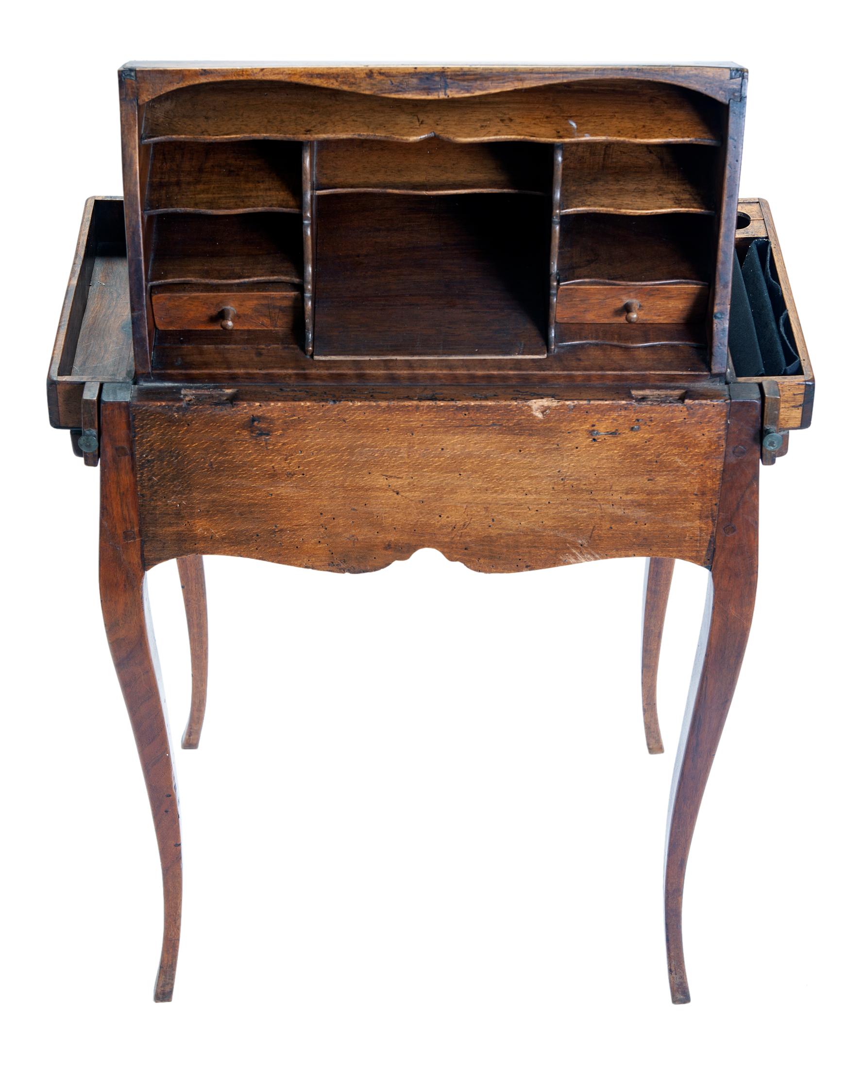 This petite secrétaire is perfect for small spaces. Small drawers with original hardware and multiple shelves are perfect to hold writing paper, notes, and small collectibles. The curved back makes it pleasing to look at from any angle. Pencil trays