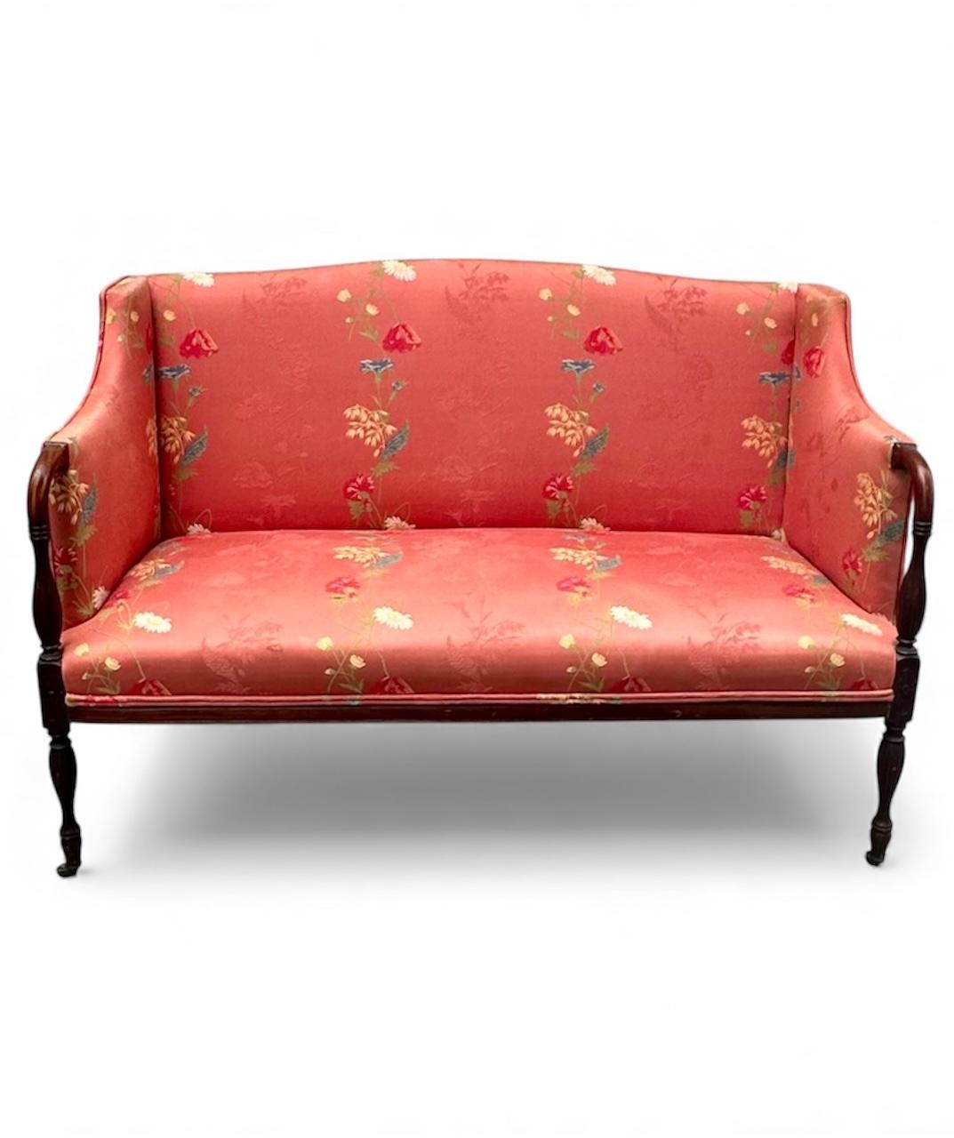 Antique Petite Sheraton Style Mahogany Camel Back Settee

This beautiful antique Sheraton style Mahogany settee, circa 1910 combines classic charm with fine craftsmanship. The gracefully curved camel back with elegant carved armrests, is supported