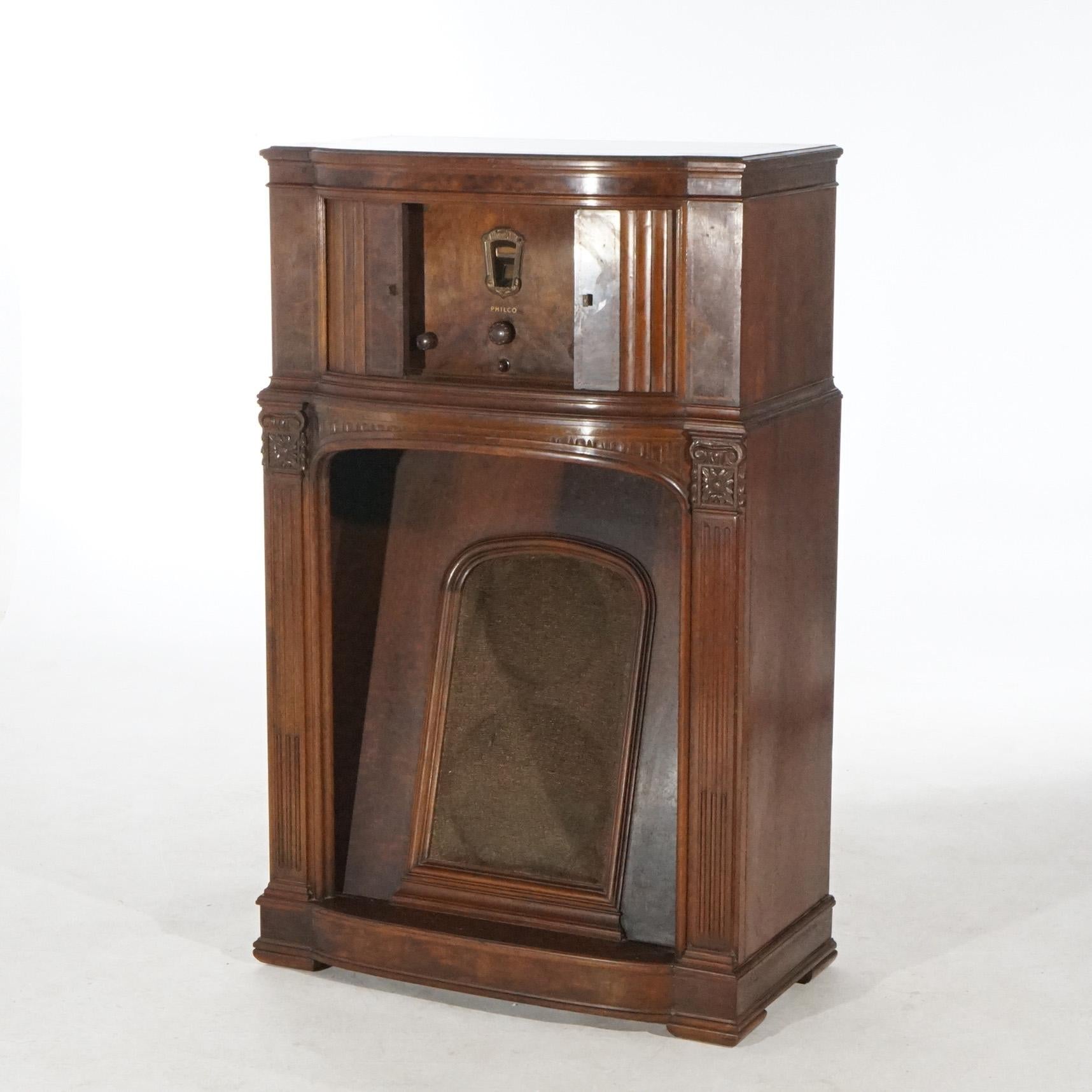 An antique Philco floor model radio offers mahogany and burl case with upper tambour doors opening to controls, c1920

Measures- 47.25''H x 29.75''W x 17''D.


