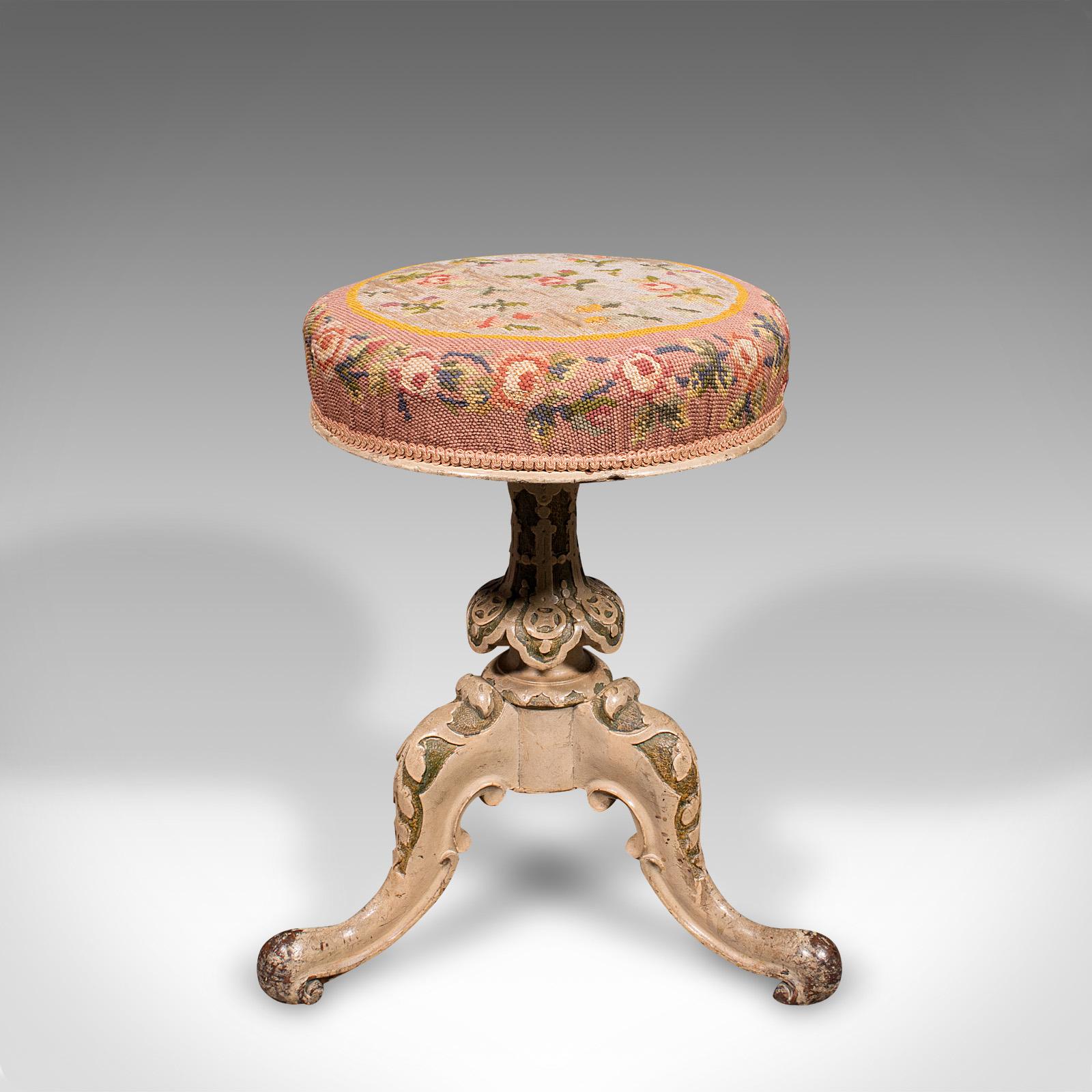 This is an antique piano stool. An English, painted music stool with riser, dating to the early Victorian period, circa 1850.

Appealing Victorian music stool with adjustable height
Displays a desirable aged patina and in good order
Painted mahogany