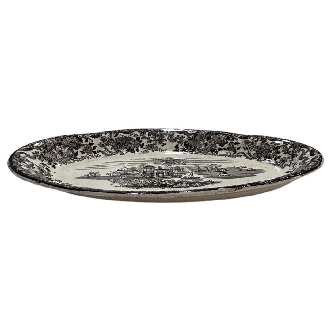 Excellent condition ~ no chips or cracks Note: there is natural crazing through due to age. Historic black/cream oblong pattern dish from Pickman S.A La Cartuja De Sevilla; border of plate is of nature flourishing flowers; center is