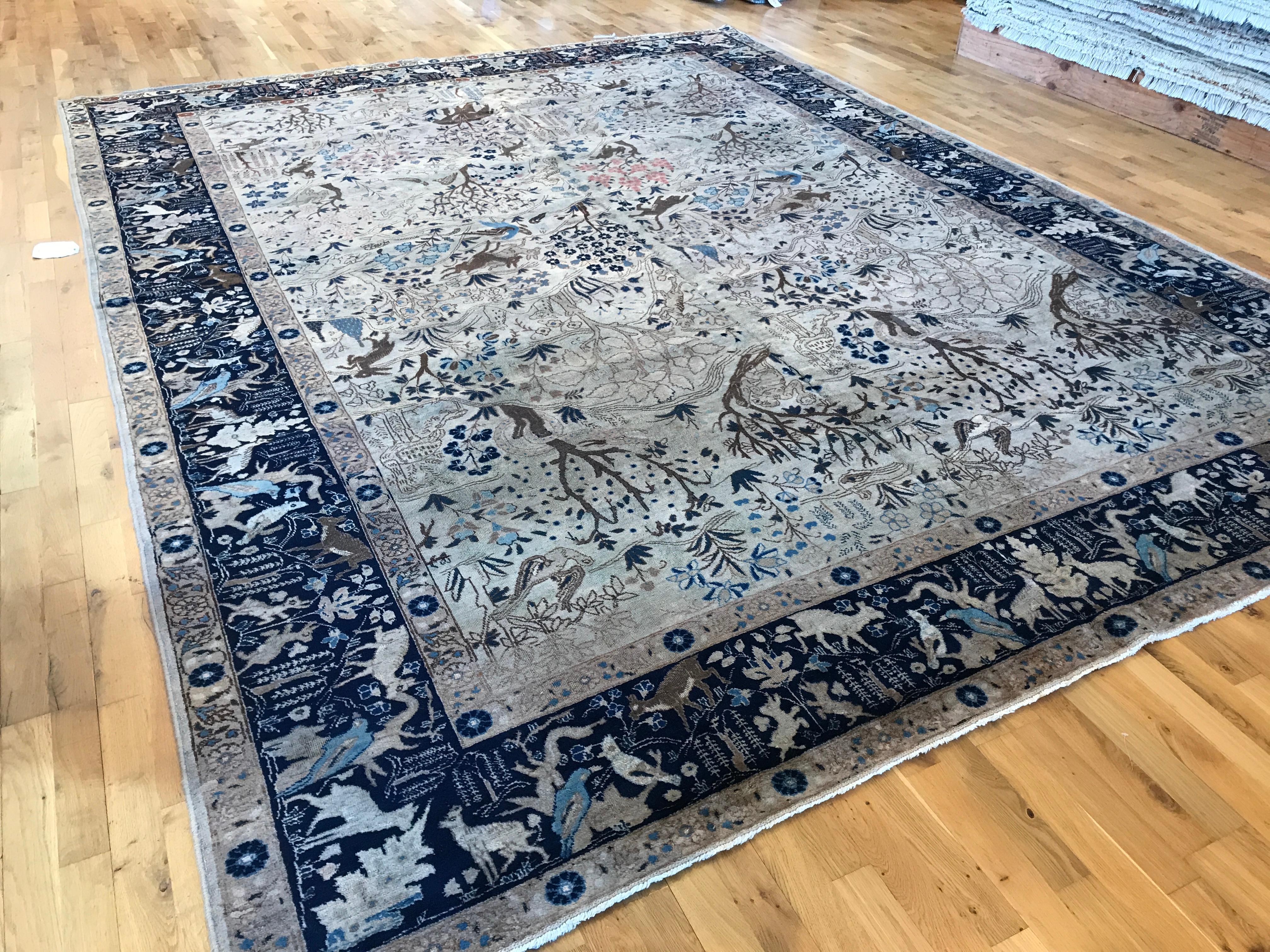 Antique pictorial Tabriz rug circa 1890

Navy blue border with tan field. The field is a picturesque scene of deers, rabbits and trees. All wool, vegetal dyed, hand knotted by master weaver in Iran.
