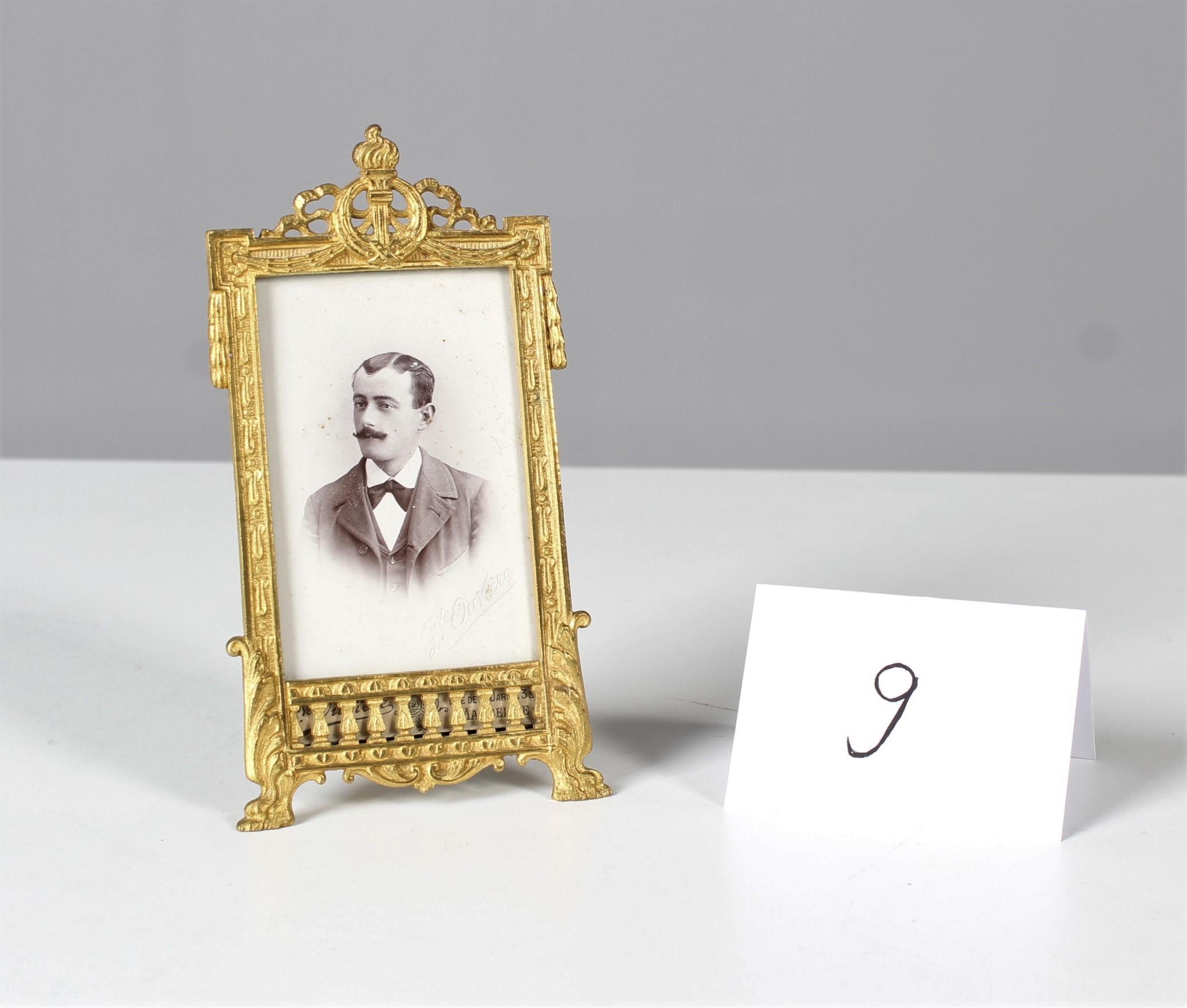 Beautiful picture frame with rich ornaments from the late 19th century with antique photo of a young gentleman.
The origin of this exceptional piece is France.
Nicely chiseled and gilded bronze work.
The Picture Size is: 5,5 x 8,5 cm.


