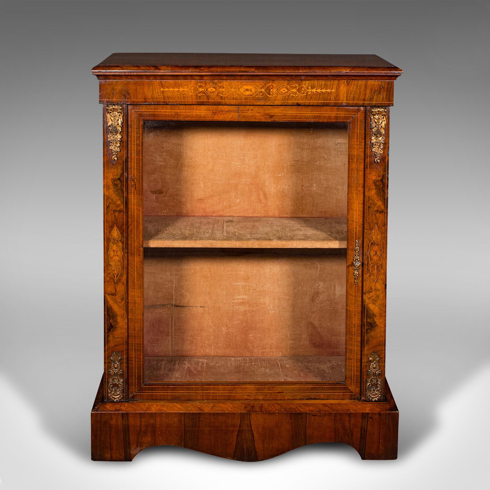 This is an antique pier cabinet. An English, walnut and boxwood inlaid display cupboard, dating to the Regency period, circa 1820.

An attractive cabinet, presenting beautifully with fine colour
Displaying a desirable aged patina and in good
