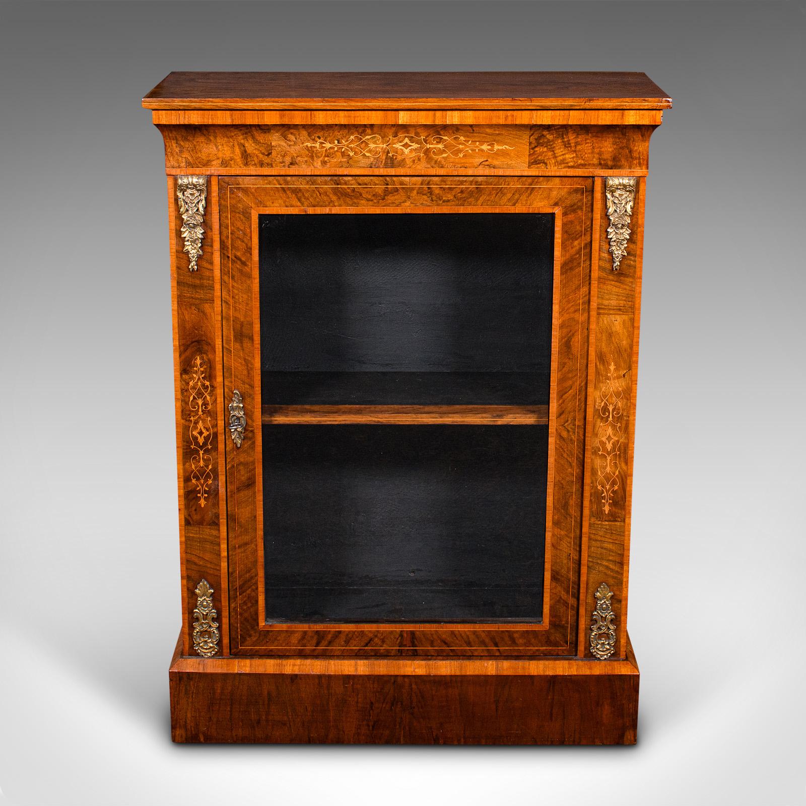 This is an antique pier cabinet. An English, walnut glazed display cupboard, dating to the Victorian period, circa 1870.

Graced with delightful inlaid detail and rich colour
Displays a desirable aged patina and in very good order
Select burr walnut